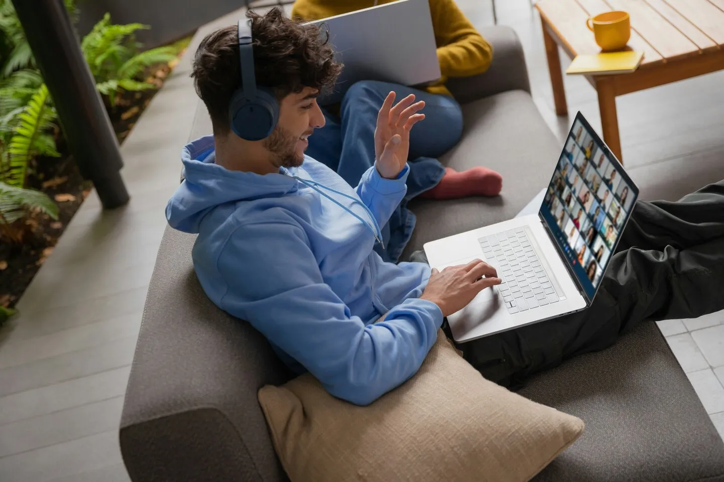man in black shirt sitting in front of computer
