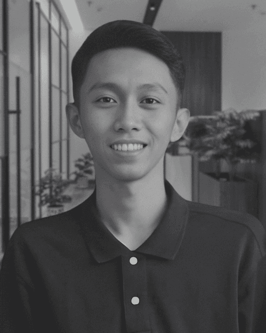 a woman sitting on a white chair next to a table