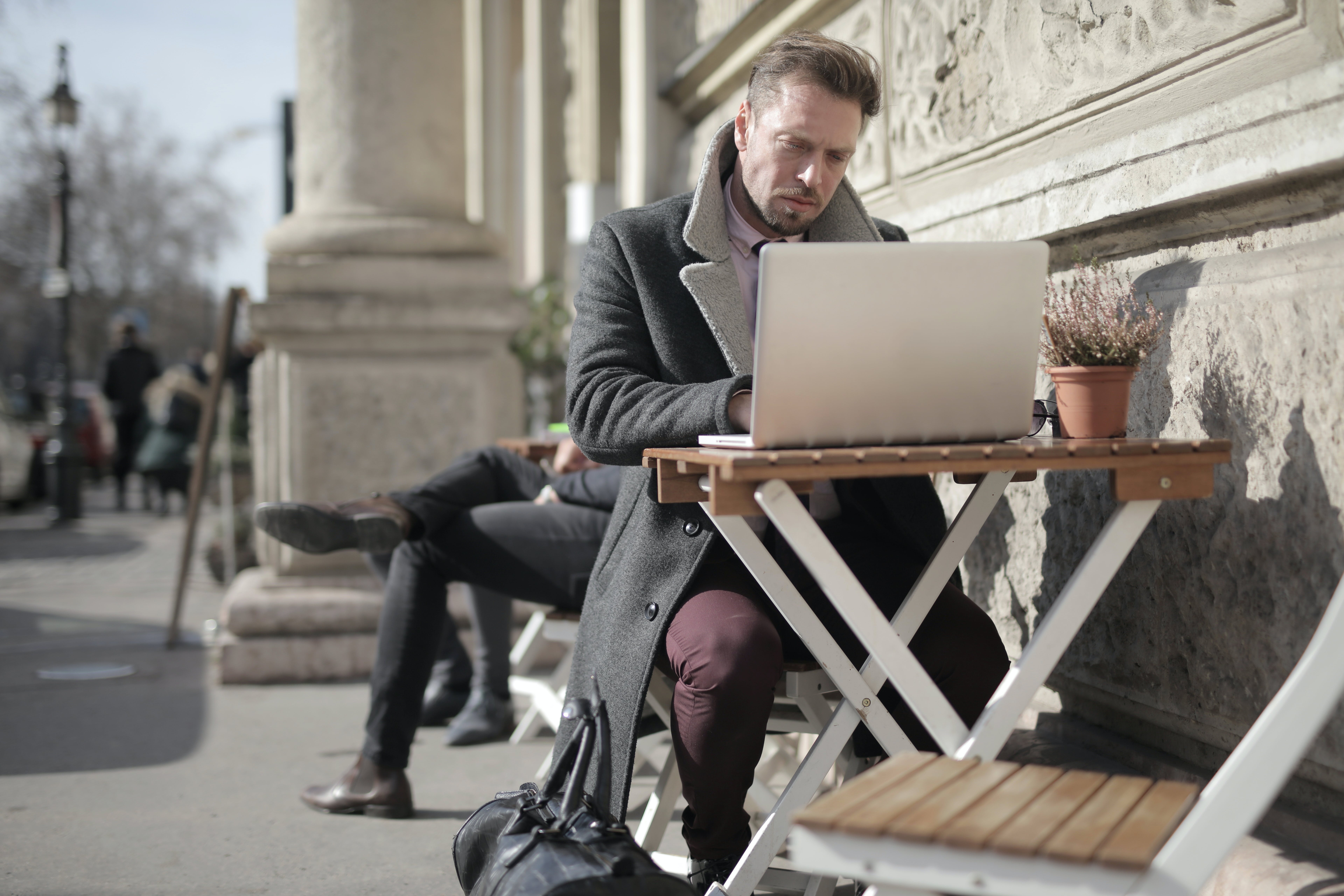 Man in black jacket mastering cold emails