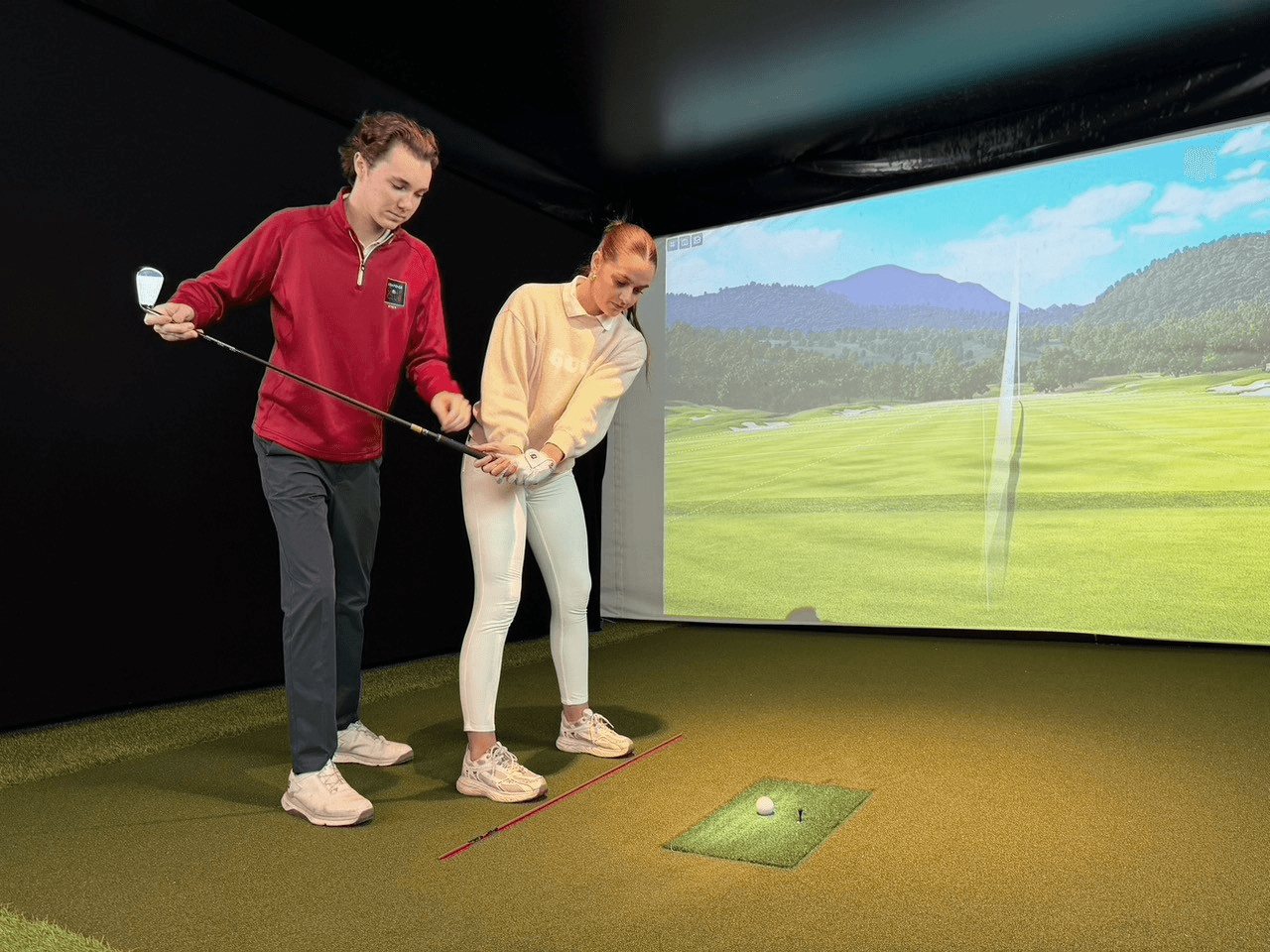 Golfer in studio in front of camera