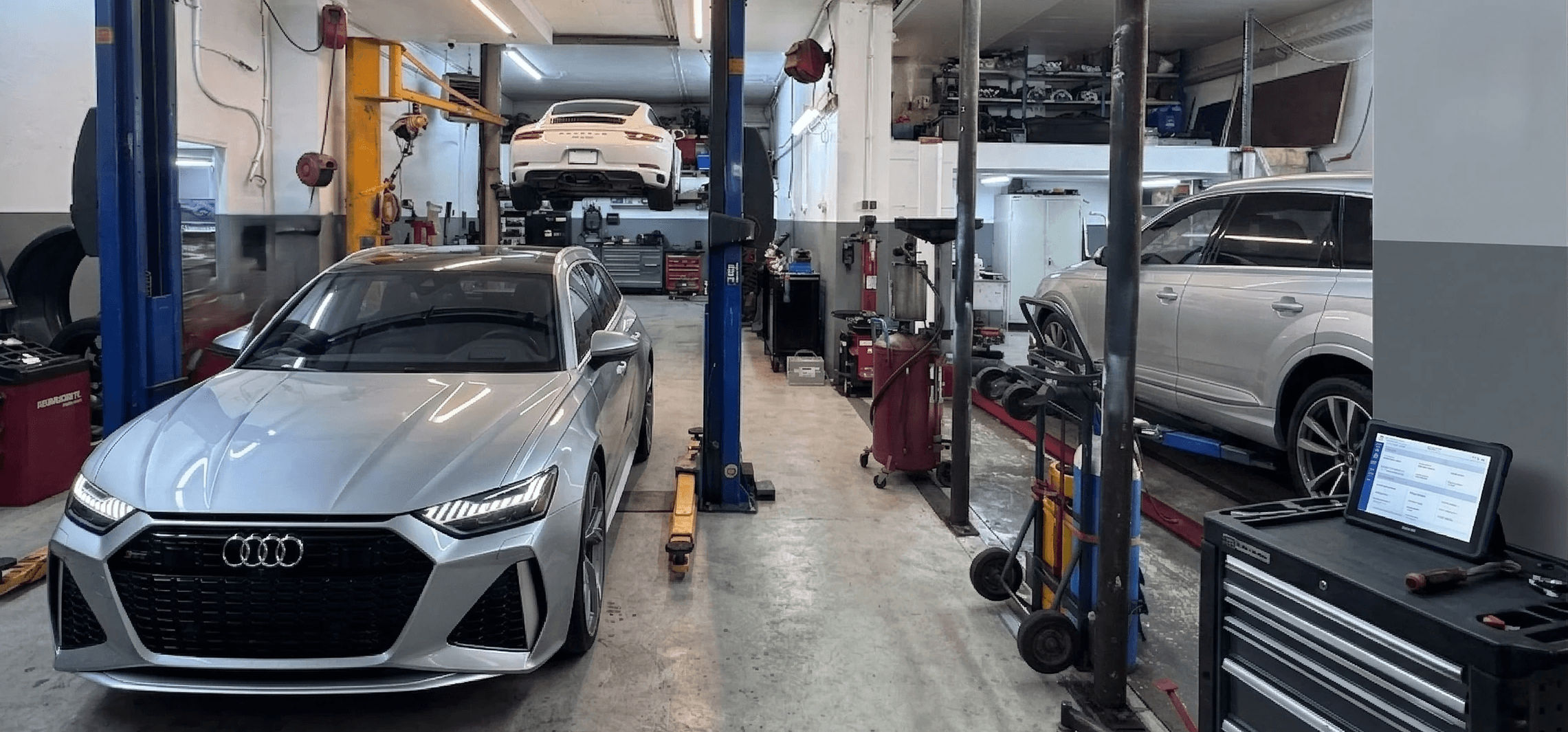 a garage filled with lots of different colored cars