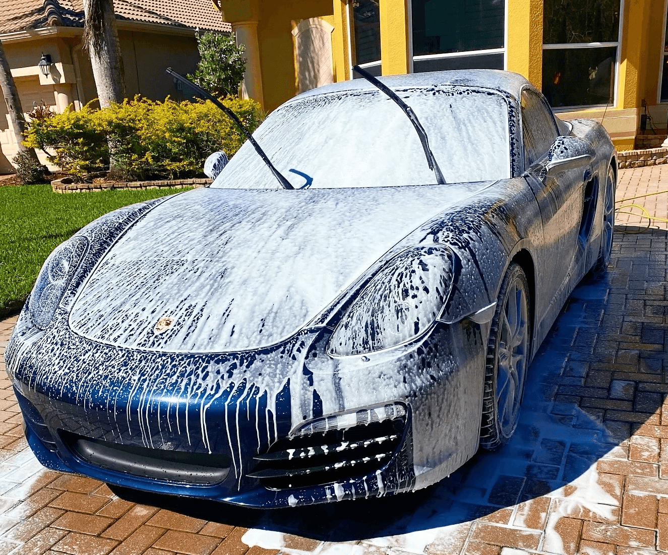 a old baby blue porsche about to receive a claybar treament to prepare for a cermaic coating in fort myers florida