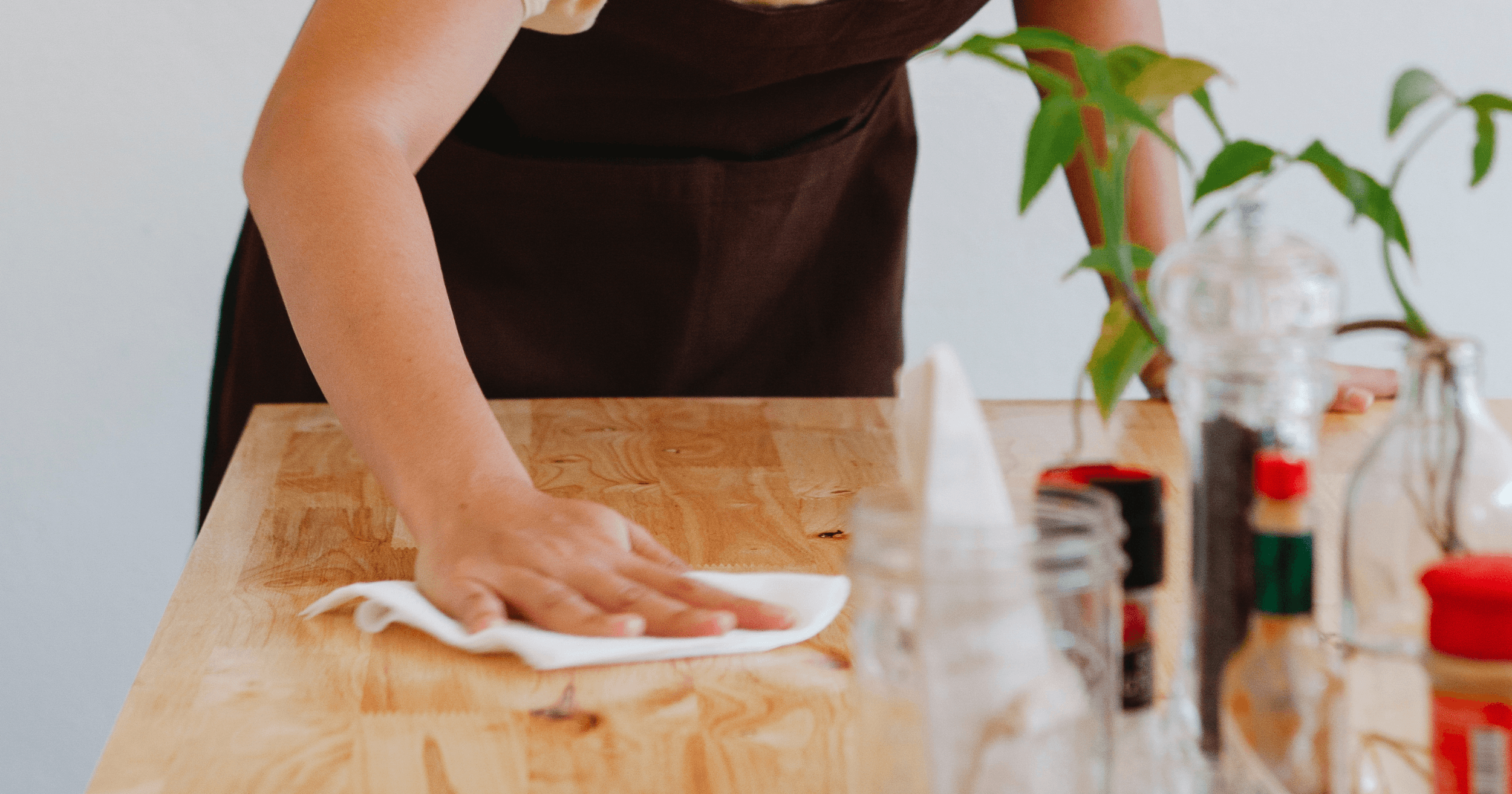 A Malaysian F&B staff wiping down the table