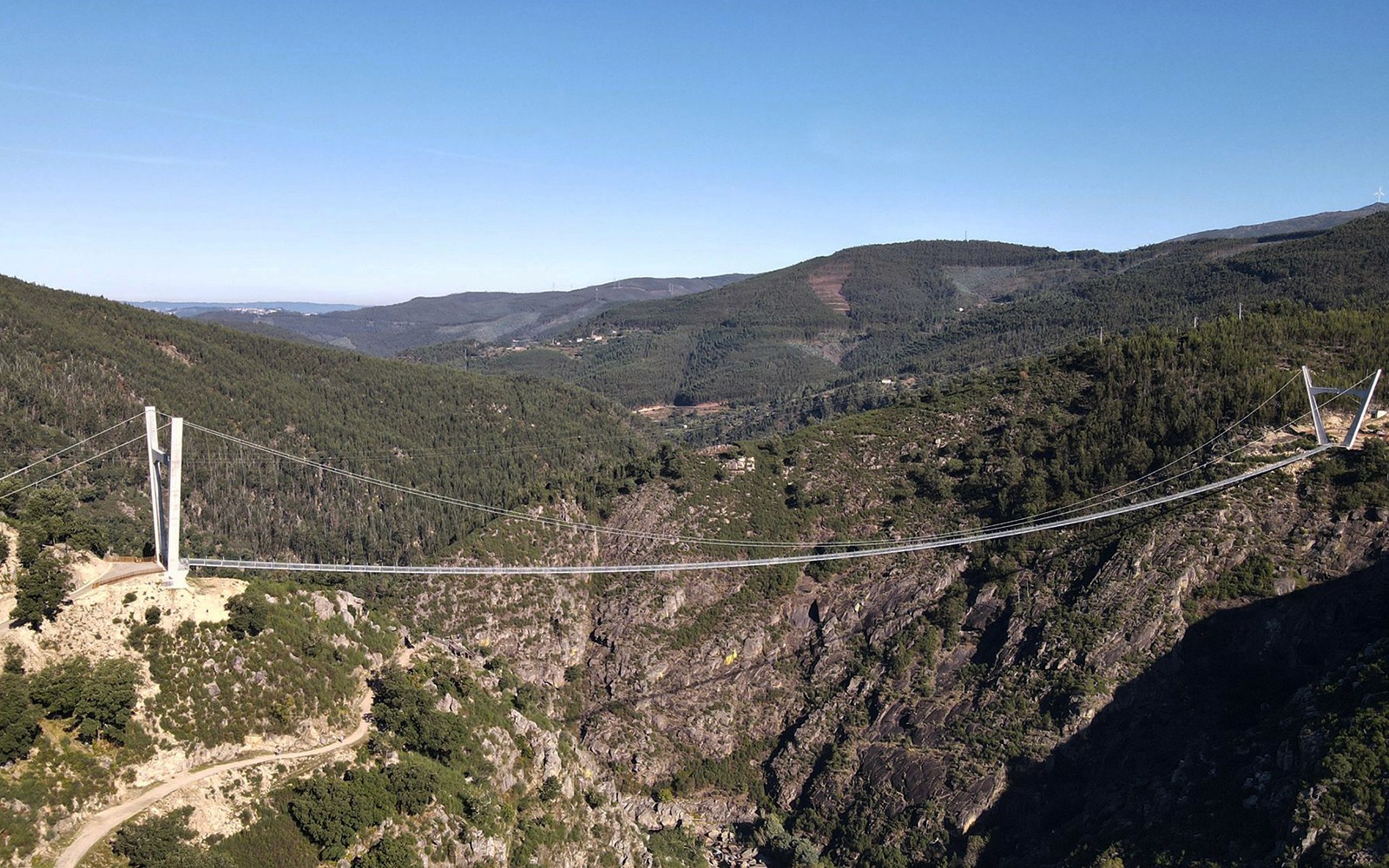 Arouca Suspension Bridge spanning a lush valley in Portugal.