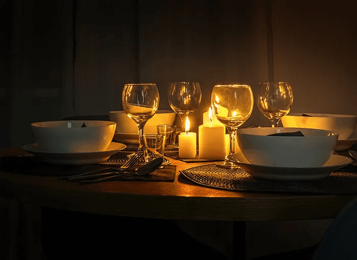 Romantic candlelight dinner setup at Au Revoir Resort – the perfect spot for couples, honeymooners, and first-night celebrations. Experience luxury dining in an intimate ambiance