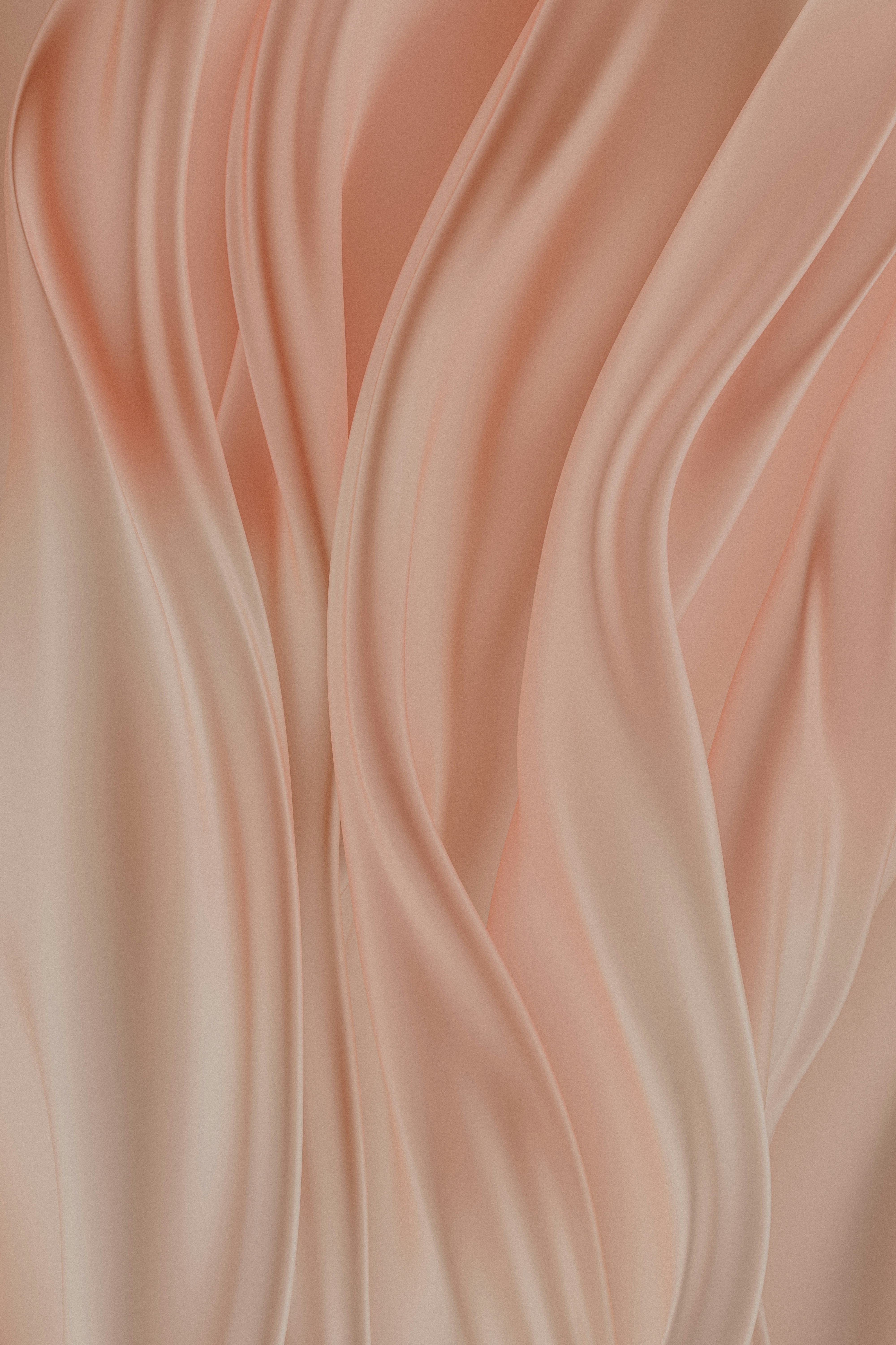 Peach-coloured silk fabric with a smooth, soft texture