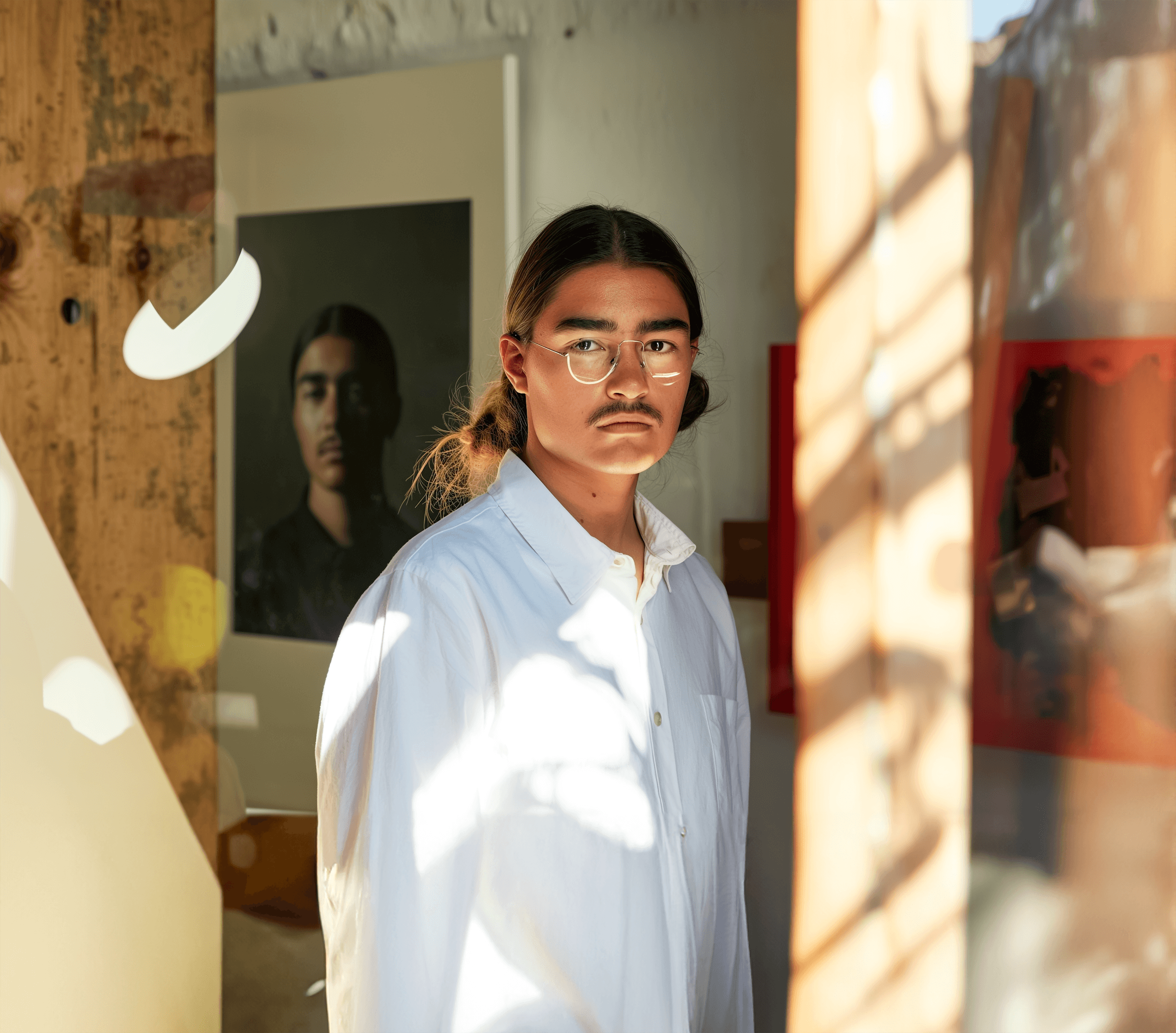 Creative portrait with geometric pink eyewear and bold fashion styling in urban setting