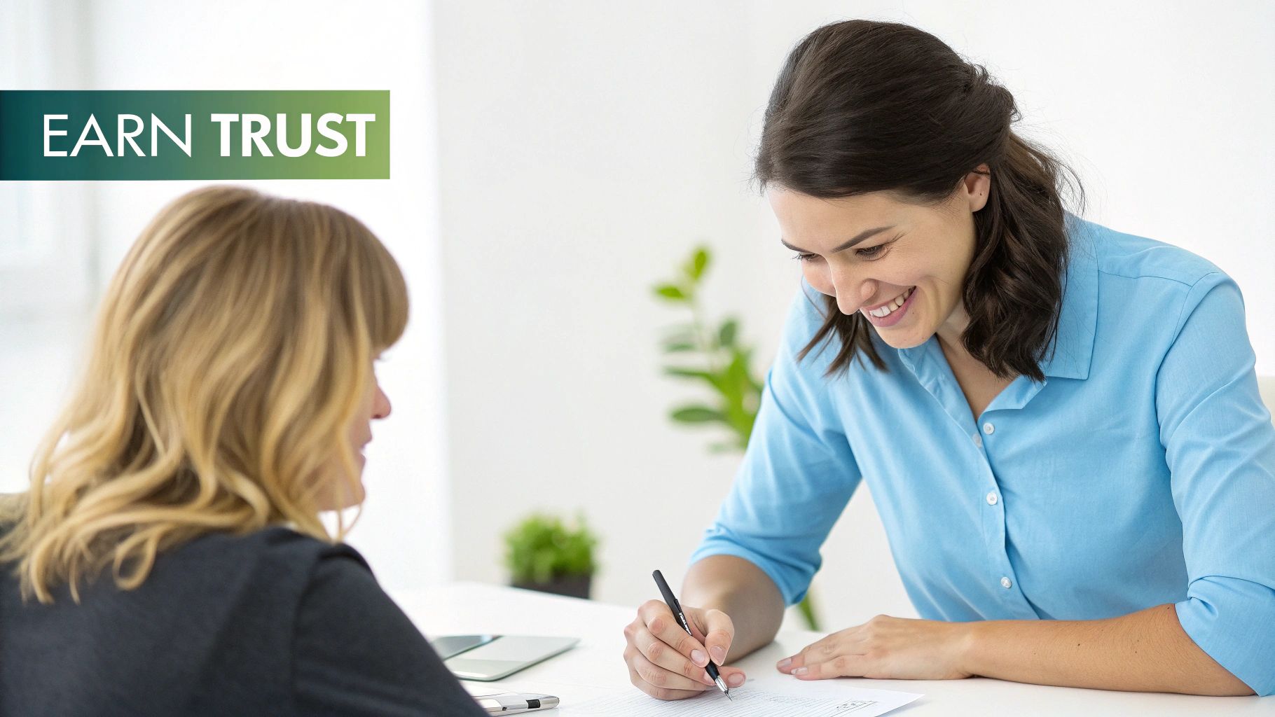 A smiling woman in a blue shirt writes on a document, demonstrating earning trust.
