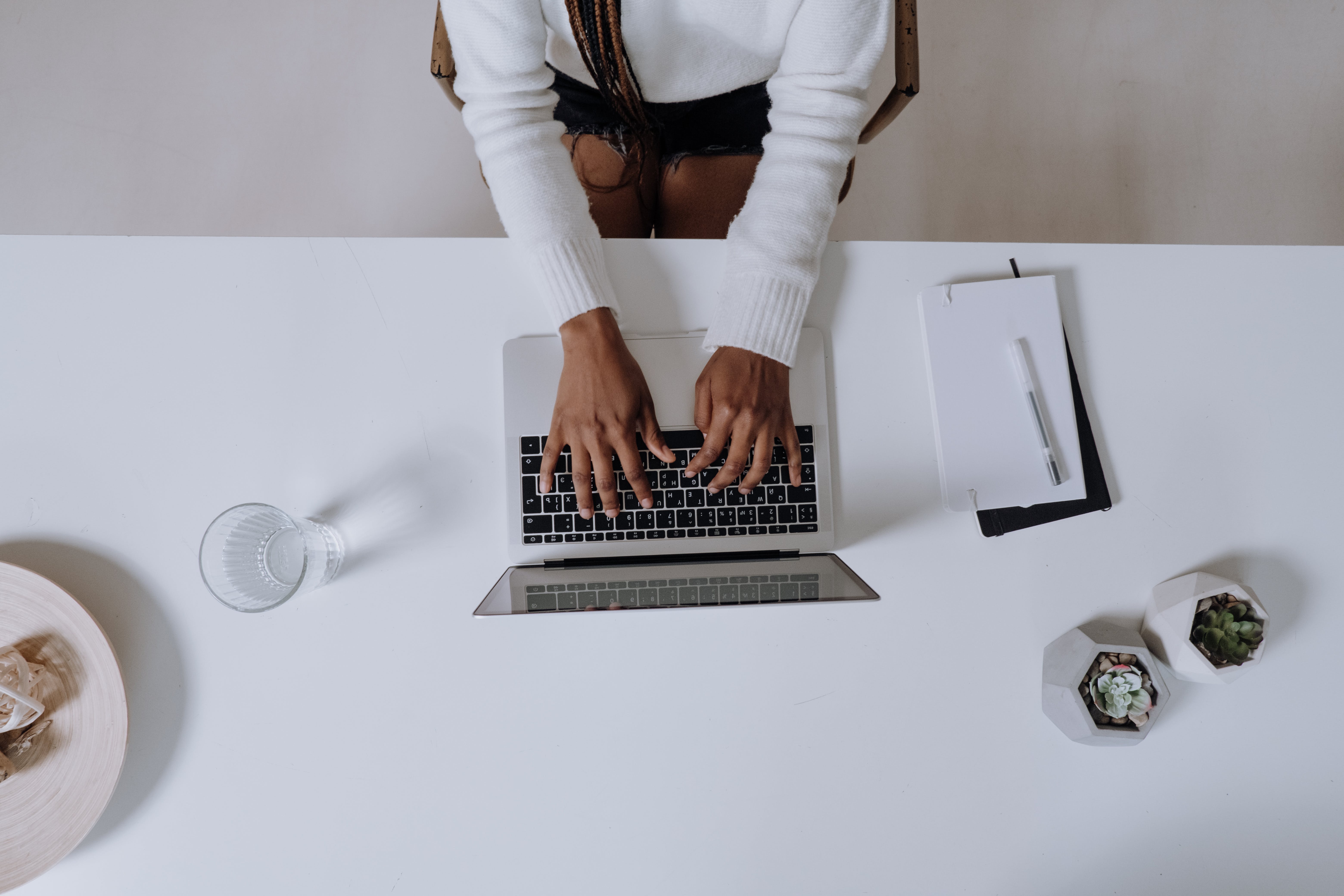 Woman in long sleeve shirt using laptop to win big with smart conversion tactics