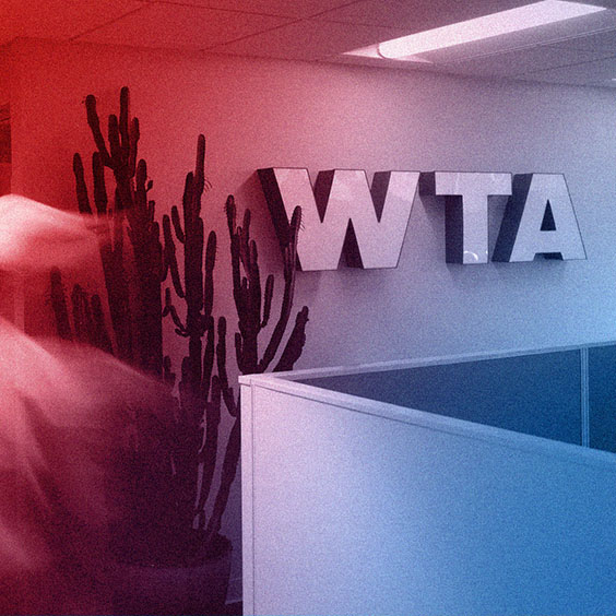 WTADS interior logo signage with red blue gradient overlay.