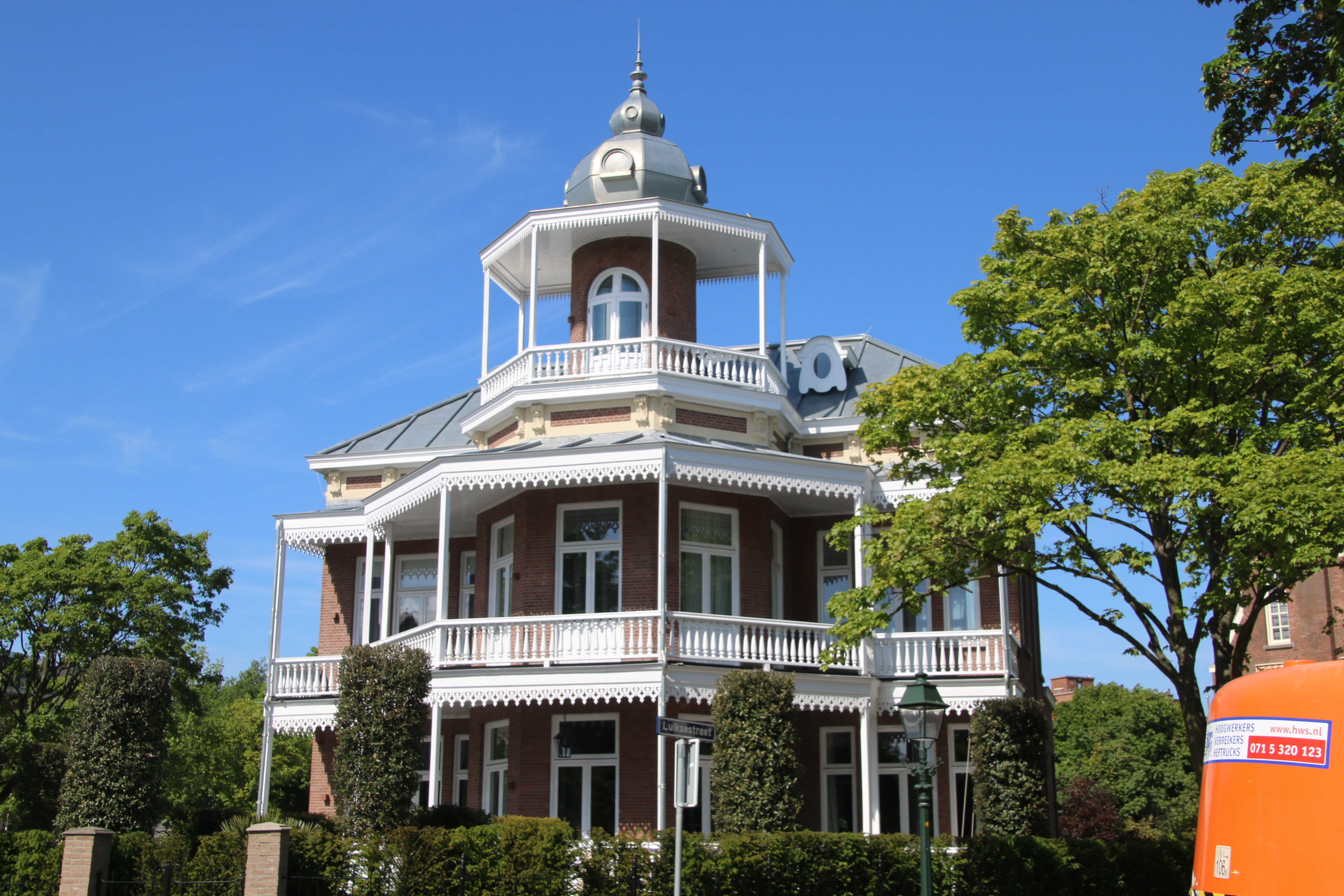 white and brown wooden house near swimming pool during daytime