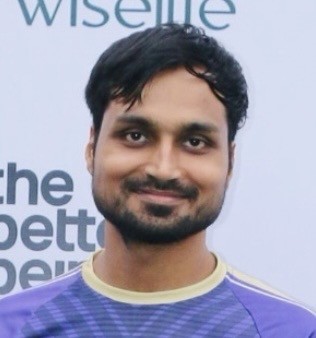 man in gray crew neck t-shirt and gray shorts sitting on basketball court