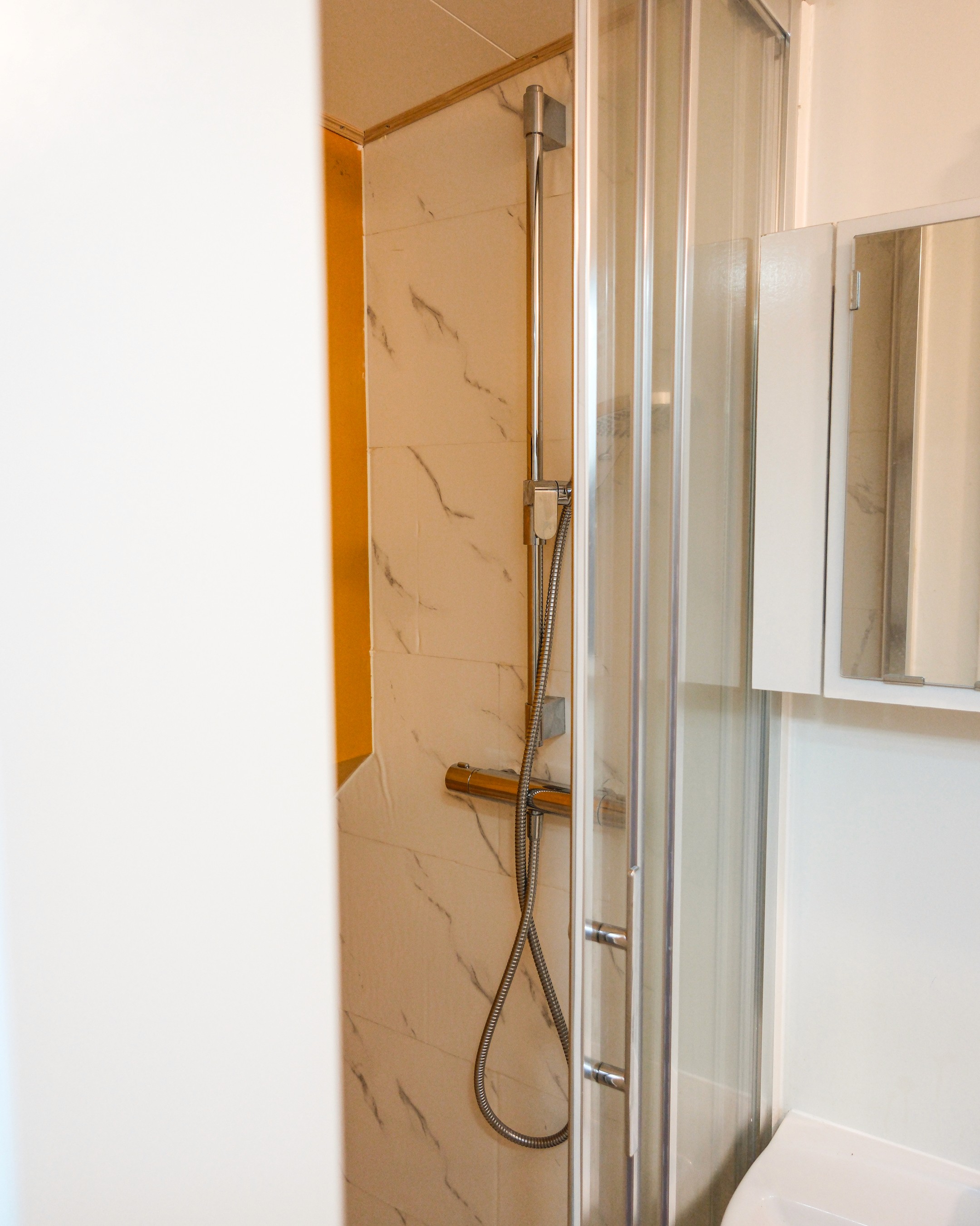 Classic bedroom with canopy bed and patterned pillows
