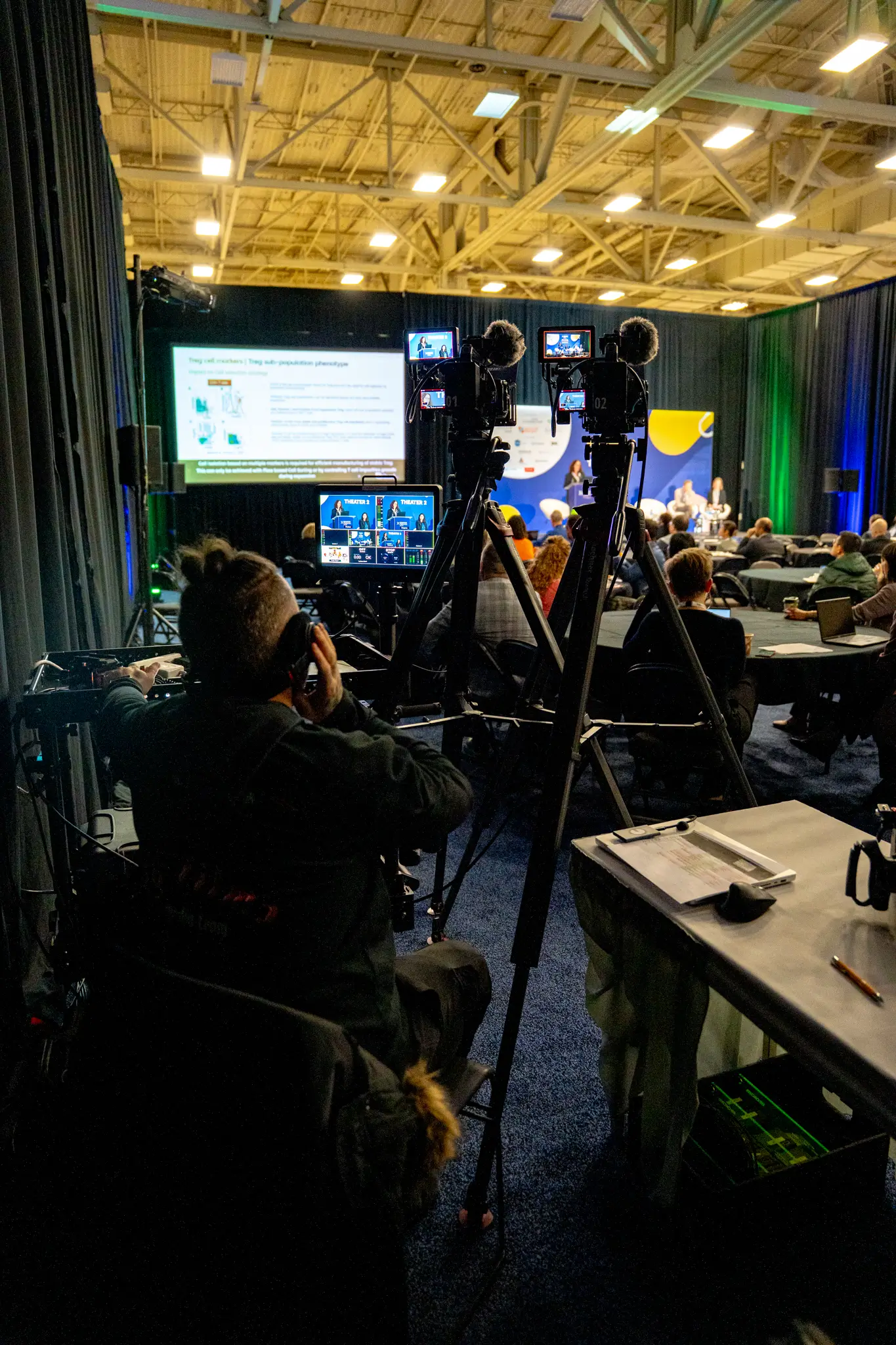 Portrait of a person in dark clothing speaking on a phone