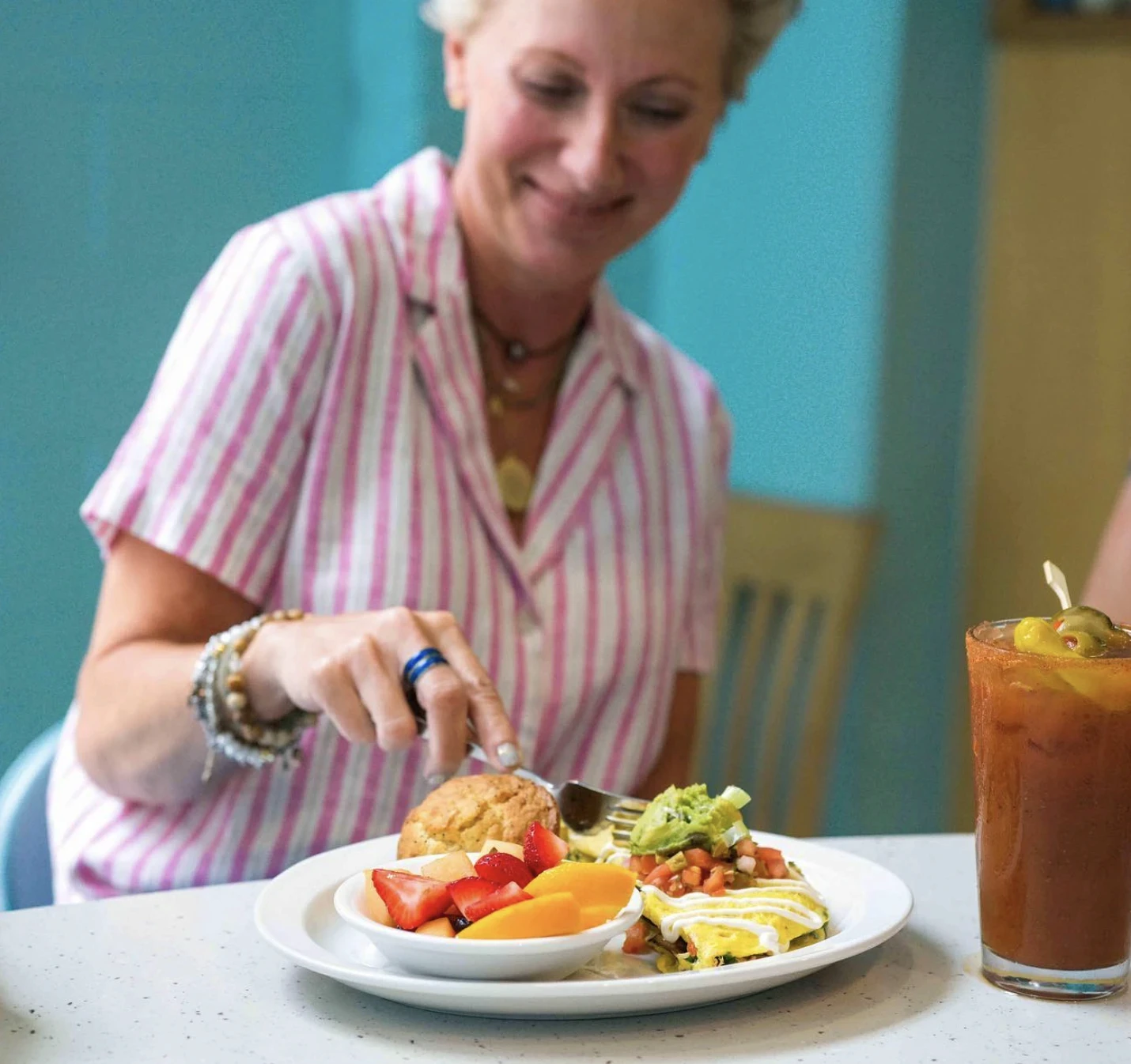 Person Eating Omelet at Wild Eggs Brunch