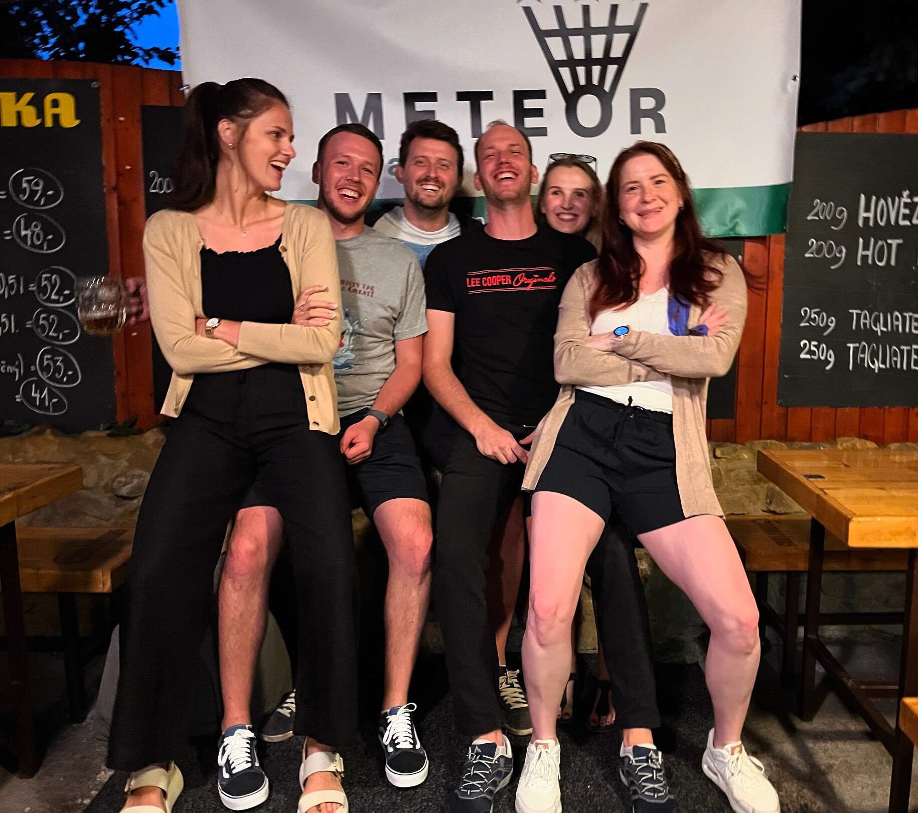 a japanese style building with a japanese roof and trees around it