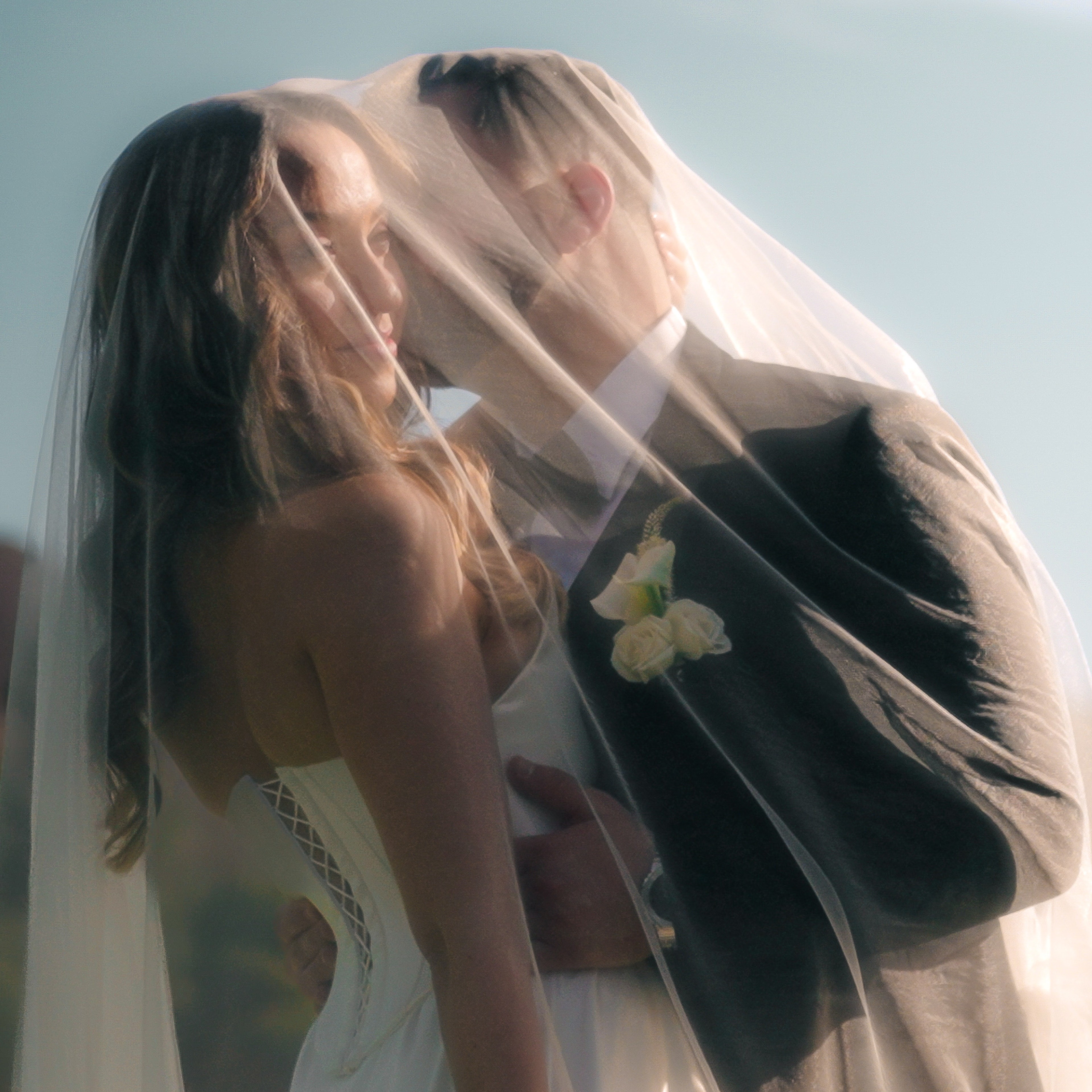 man holding gold ring on woman's finger