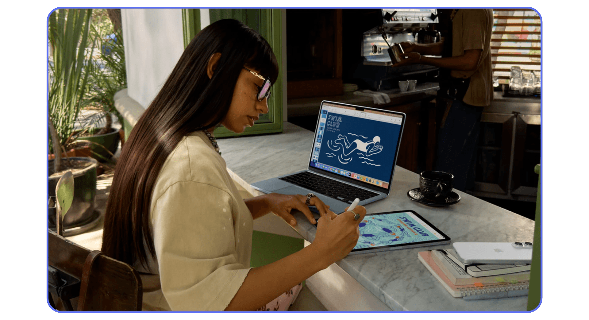 Artist working on iPad with stylus while connected to laptop for cloud-based Autodesk Maya workflow.