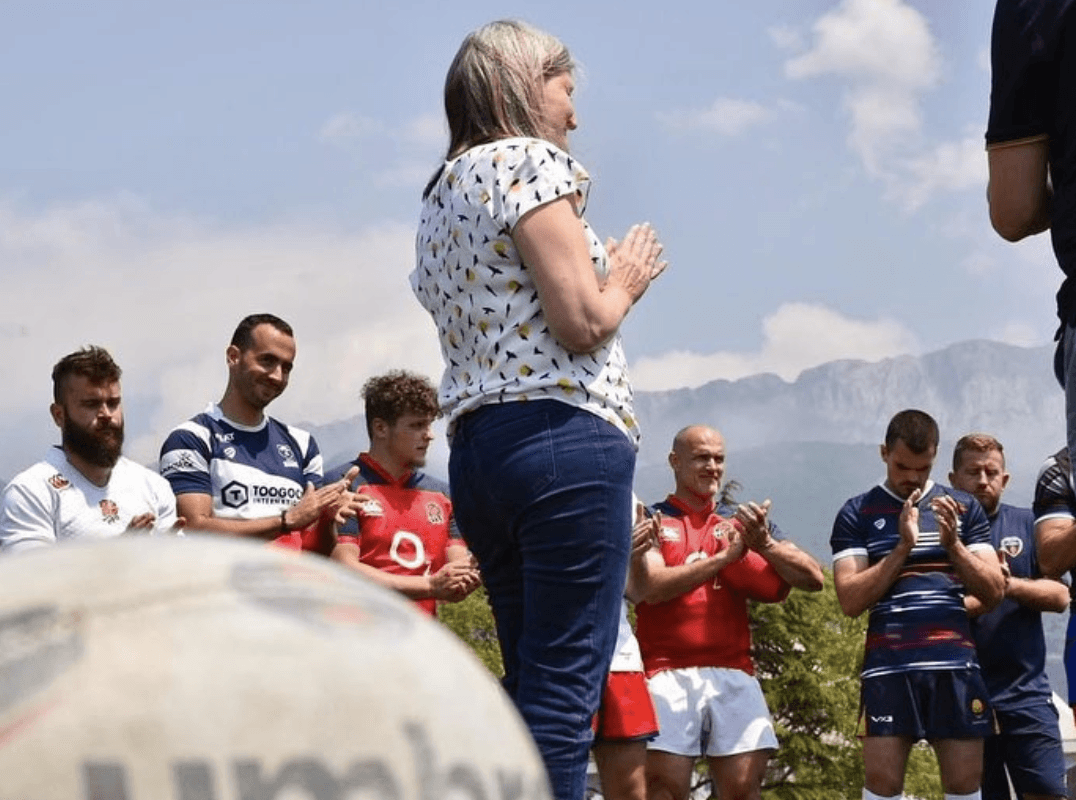 woman speaking to players