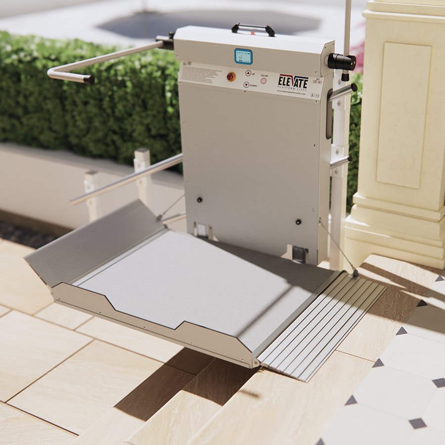 alt text for this image11:36Claude responded: Elevate Platform Lifts vertical step lift in deployed position at lower landing level — stainless steel and aluminium unit with anti-slip platform, digital con…Elevate Platform Lifts vertical step lift in deployed position at lower landing level — stainless steel and aluminium unit with anti-slip platform, digital control panel, up/down buttons, and fold-out access ramp installed at an outdoor residential or commercial entrance with decorative tiled flooring