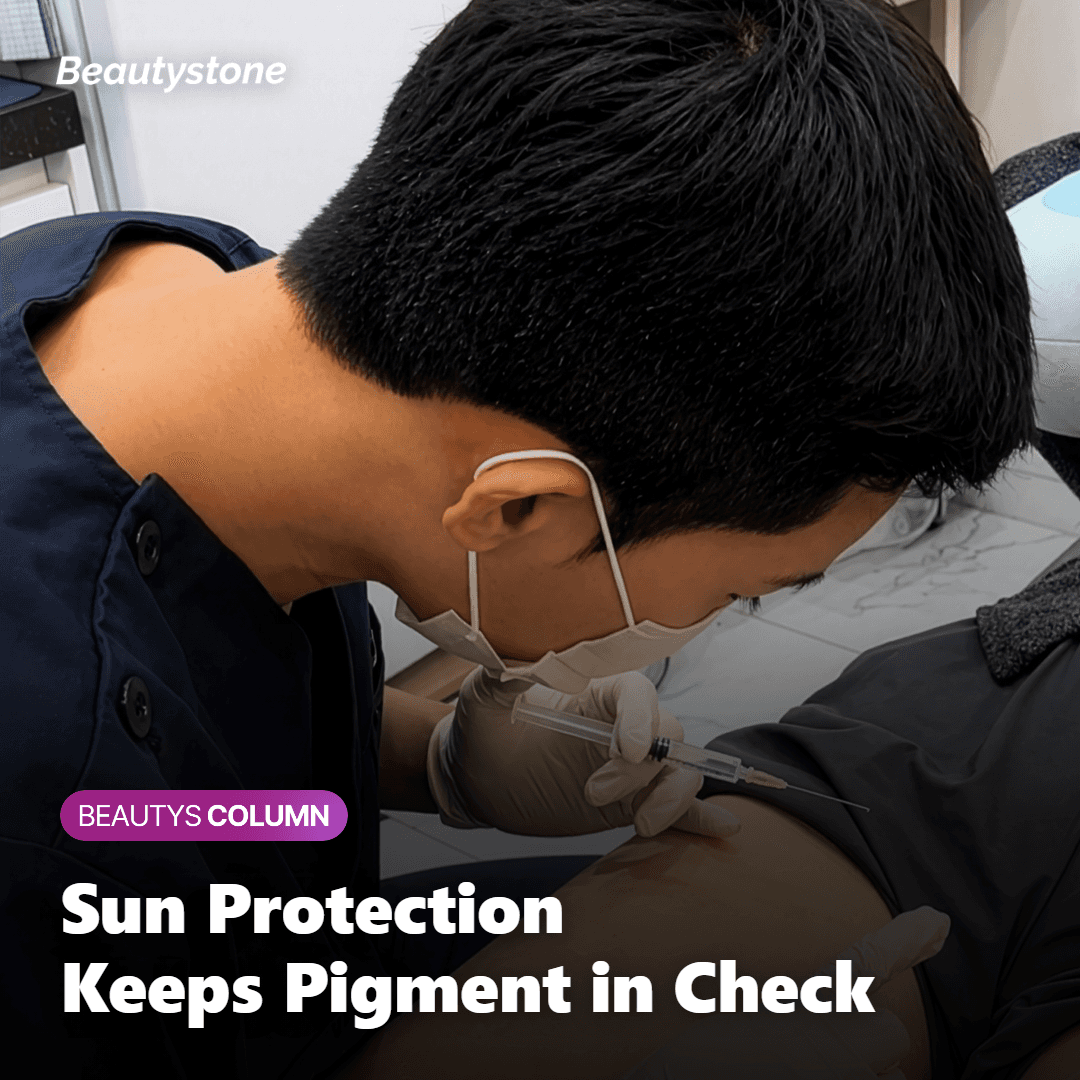 Person applying broad-spectrum sunscreen and wearing a hat for physical sun protection outdoors