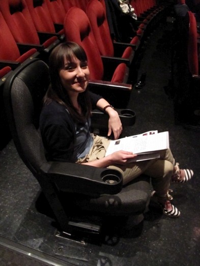 portrait of a girl sitting in a black chair