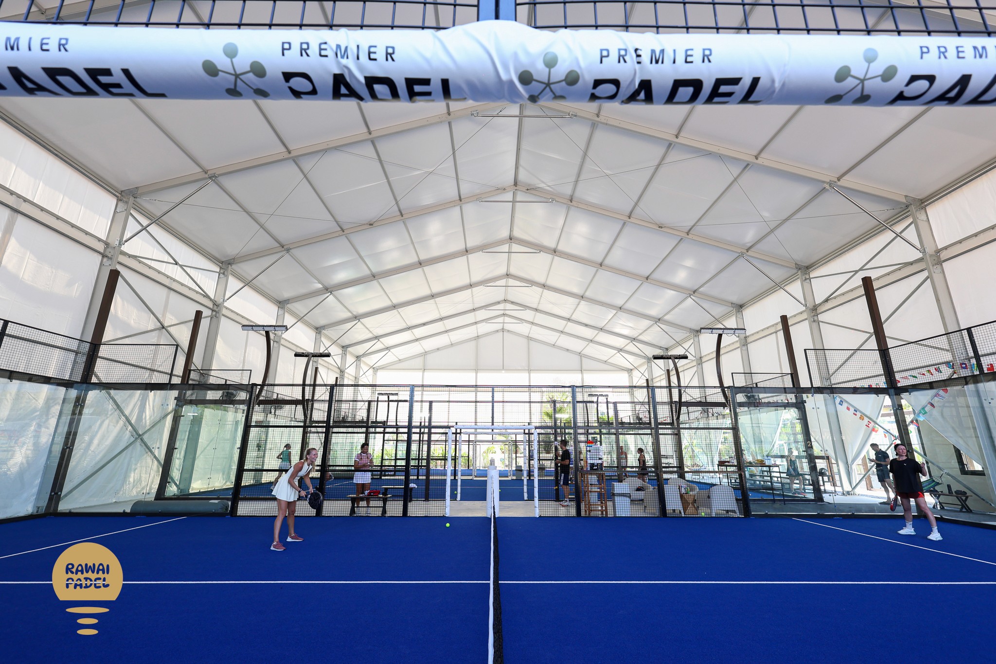 A close up of a person holding a tennis racket