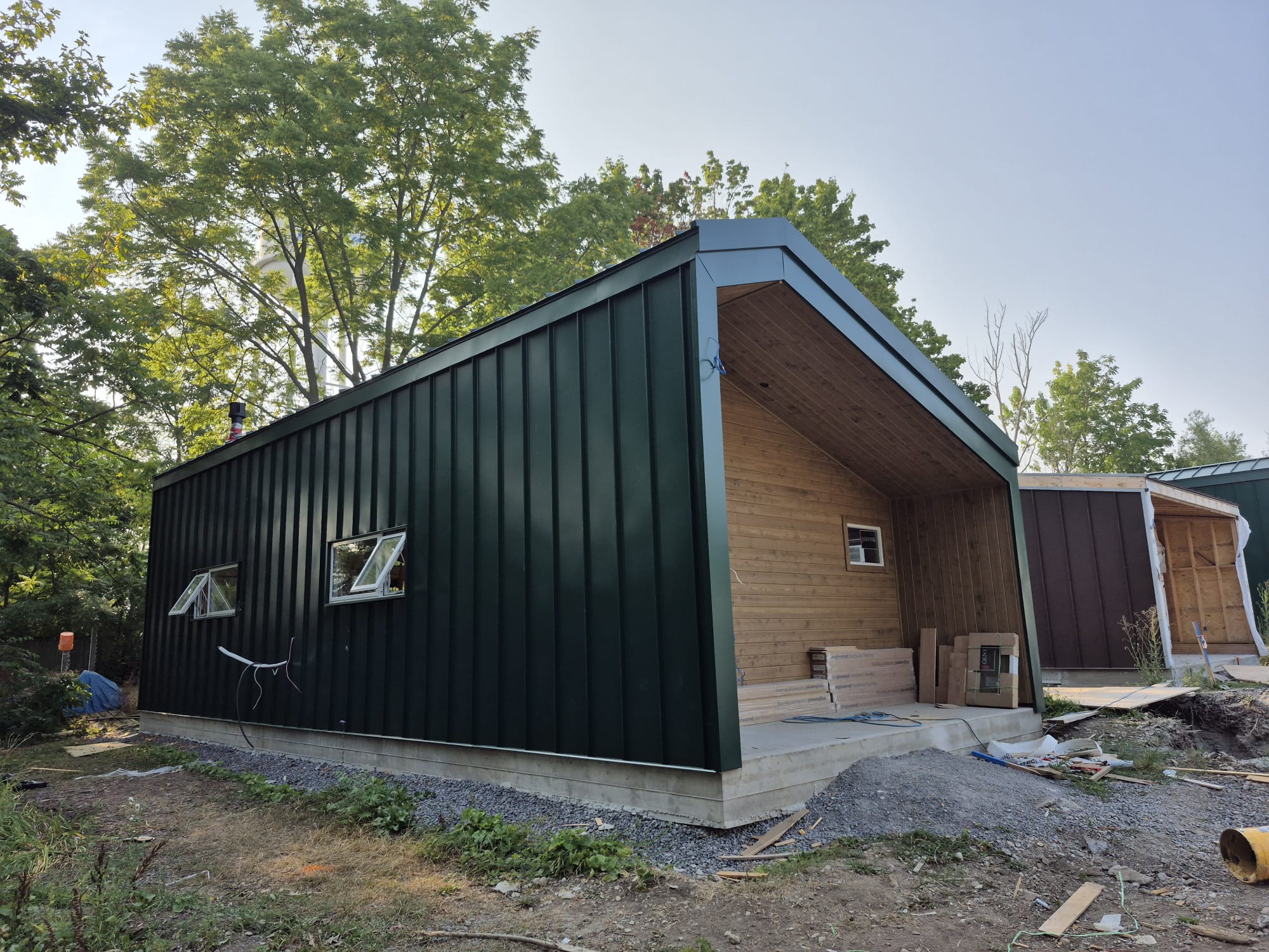 a man working on a roof with a power drill