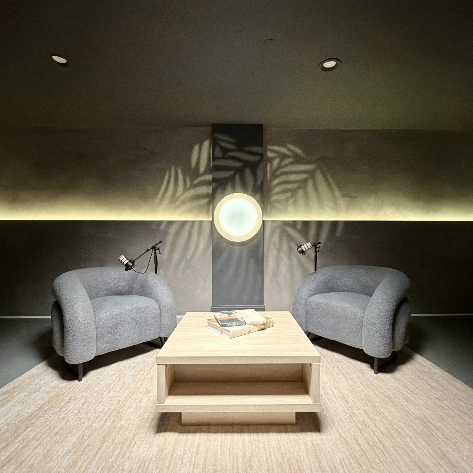 Leaf-patterned light adds another layer to the neutral lounge set.