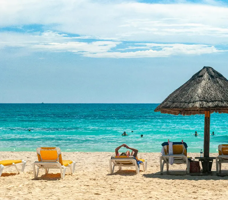 brown beach umbrellas on beach during daytime
