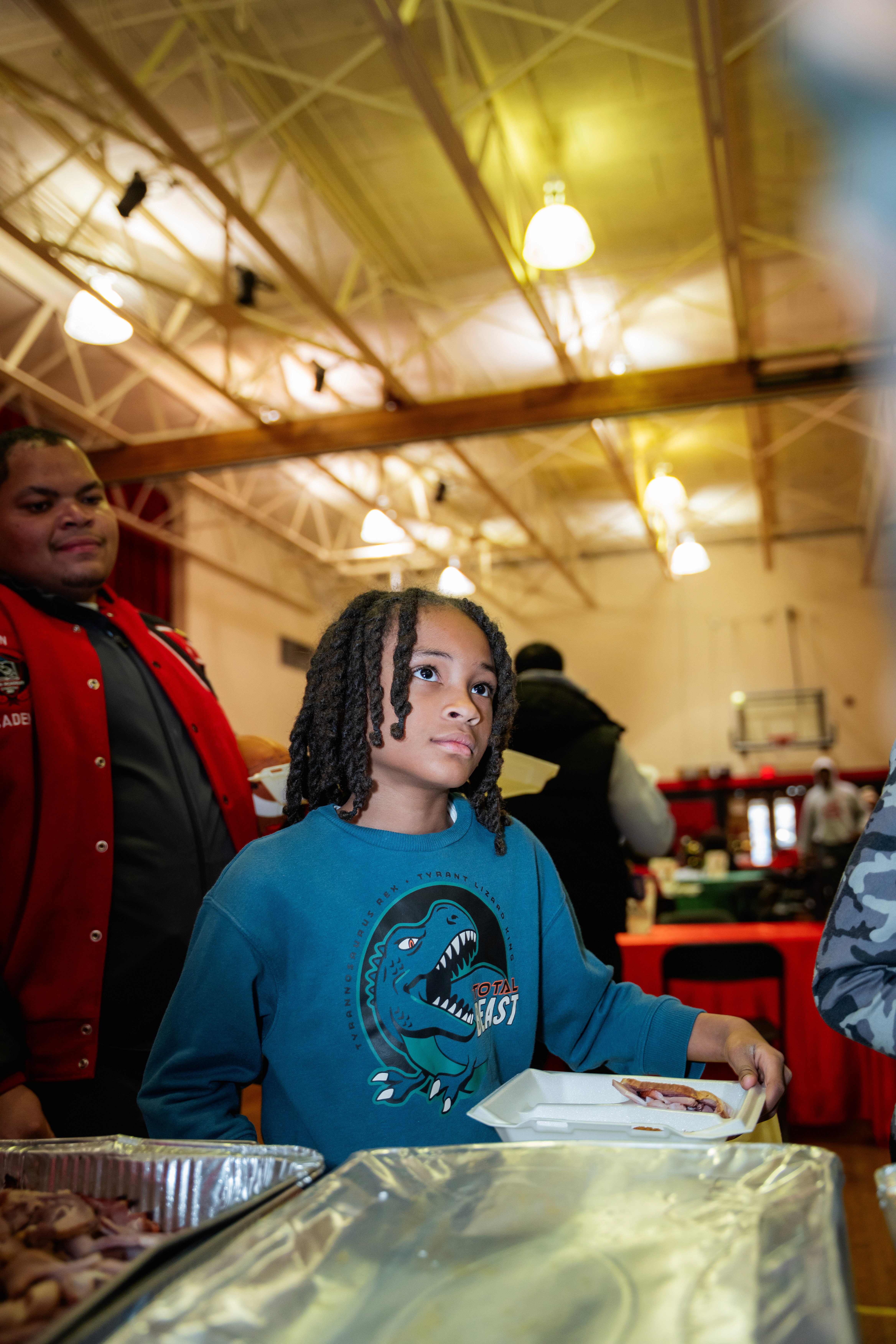 boy holding stock pot