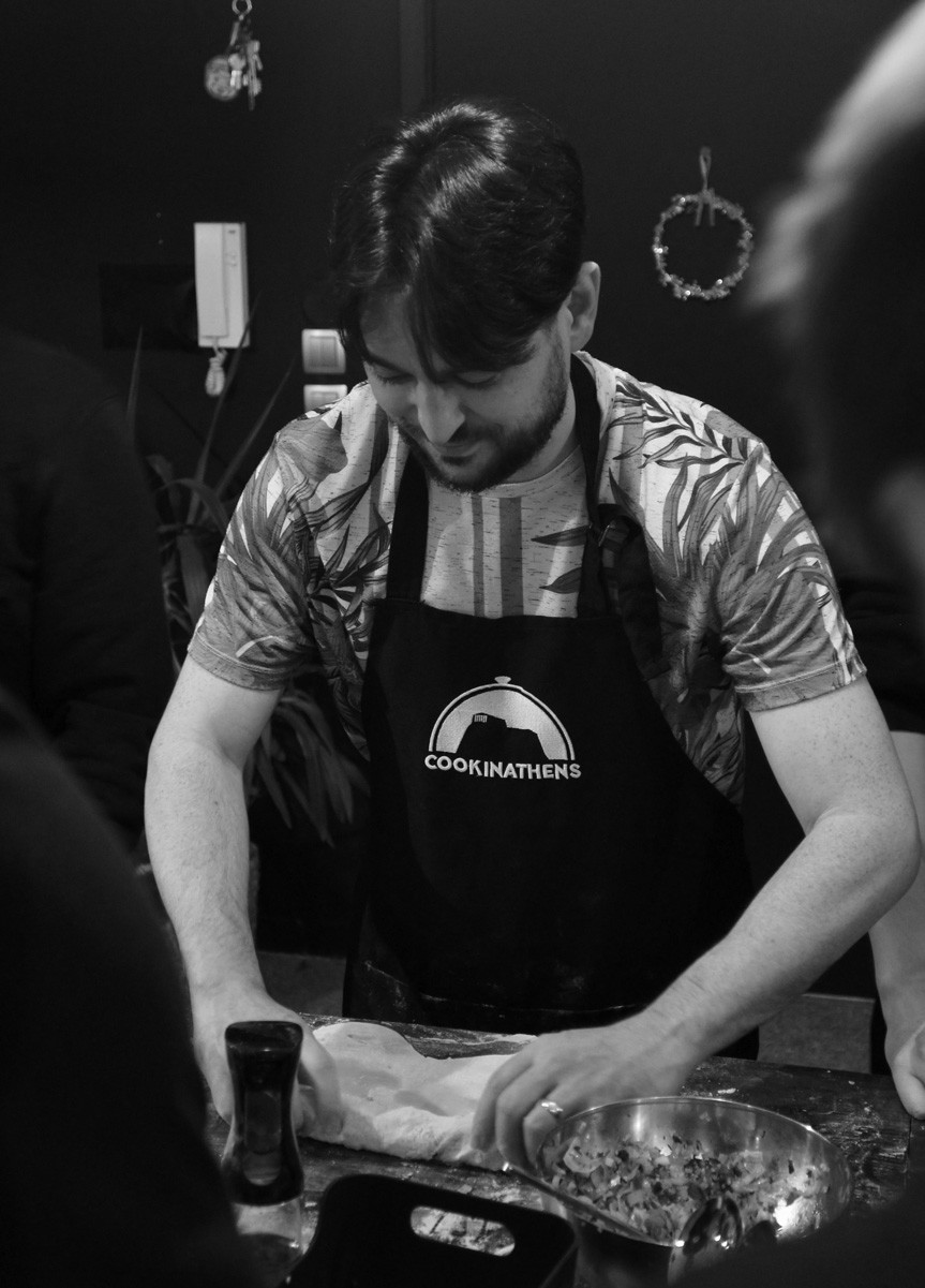 A photograph showing multiple team members walking on an old cobbled street and smiling