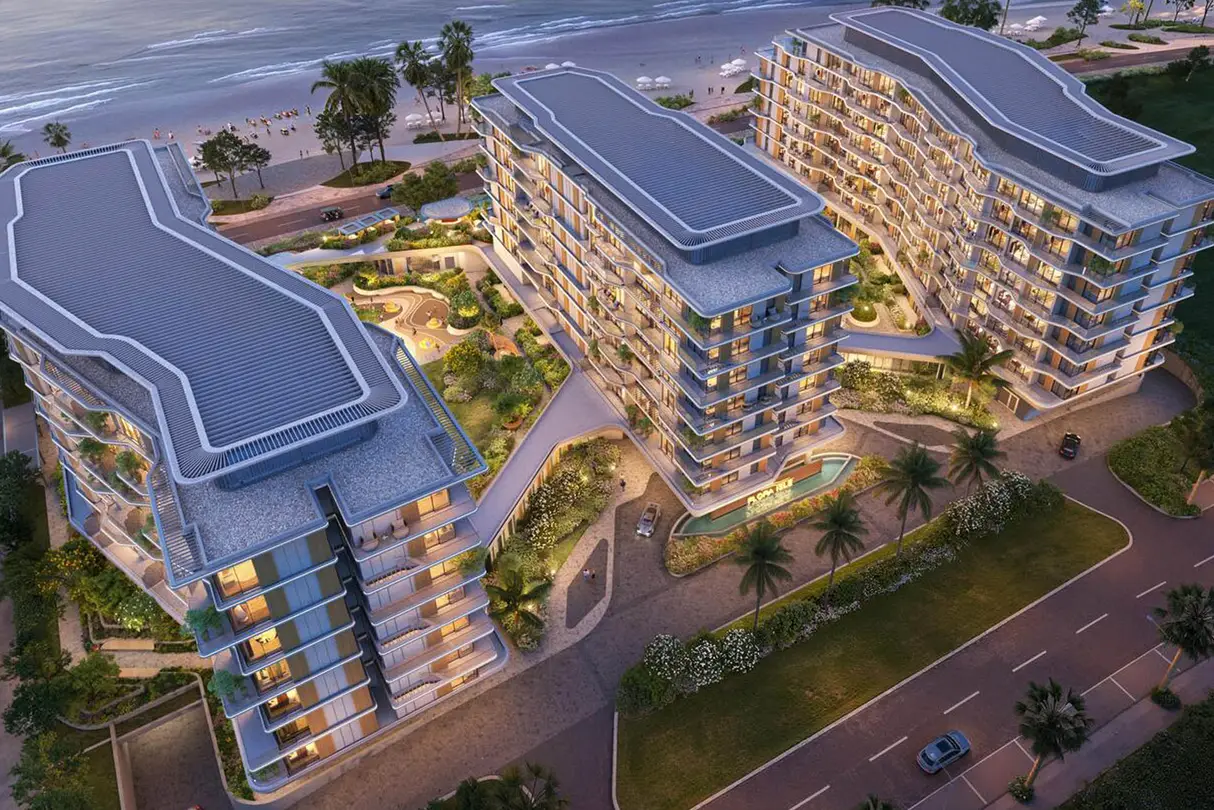 A tall building with multiple balconies on top, identified as Gharbi 2 Residences (70).
