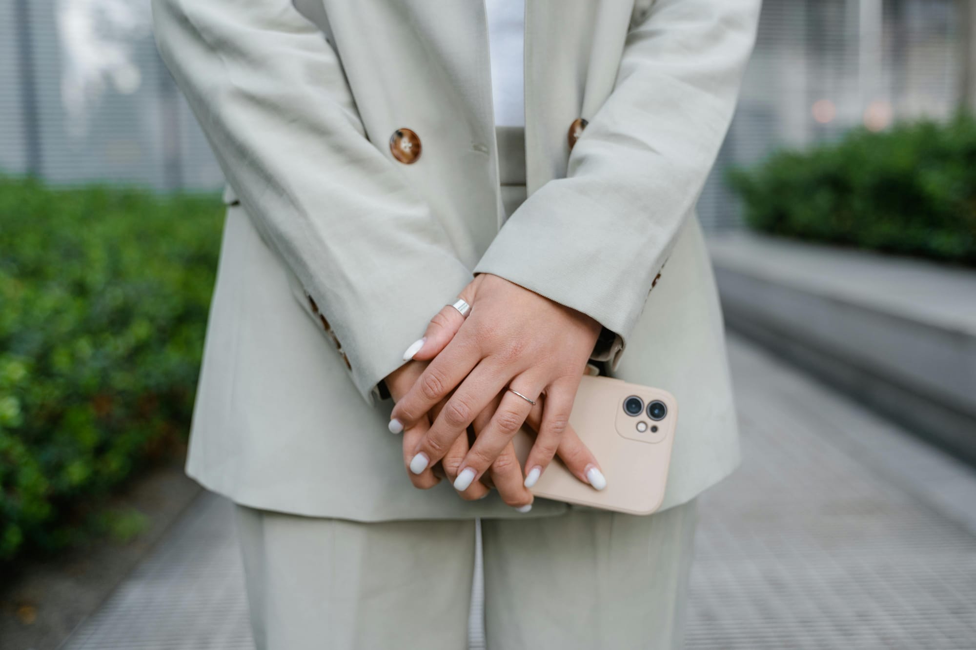 Woman holding phone with both hands