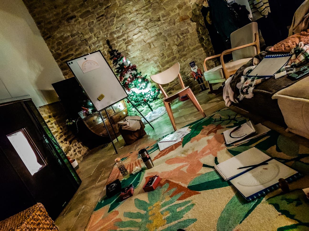 Woman siting in lotus pose meditating over a brightly lit green hill