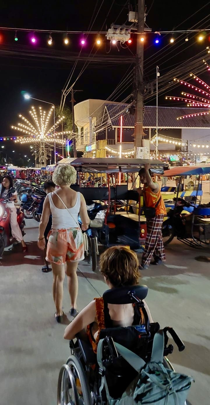 yellow Labrador retriever biting yellow tulip flower