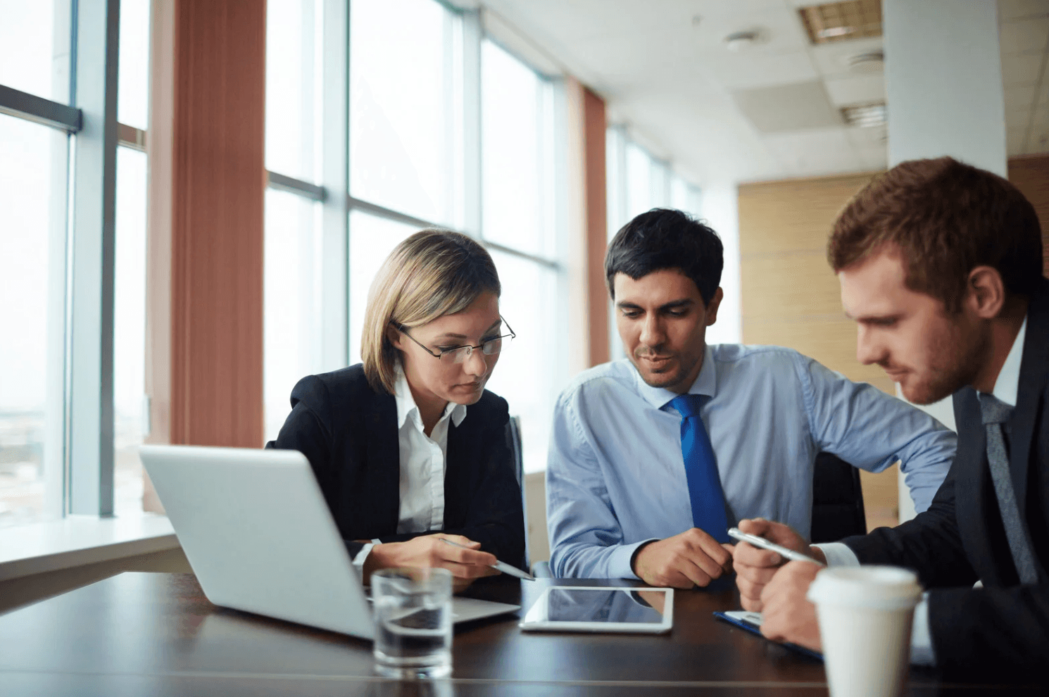 Amazon seller analyzing overlapping keyword campaigns and bid structures on a laptop to prevent budget cannibalization and ad spend waste.