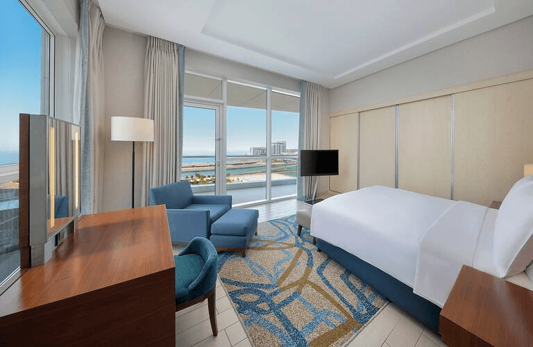 Pet-friendly hotel suite at DoubleTree by Hilton Dubai with a comfortable indoor space.