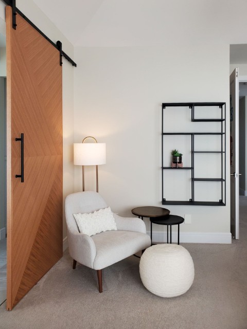Image of Cozy interior design featuring furniture, layout design, and window coverings in a KHD Homes construction project.
