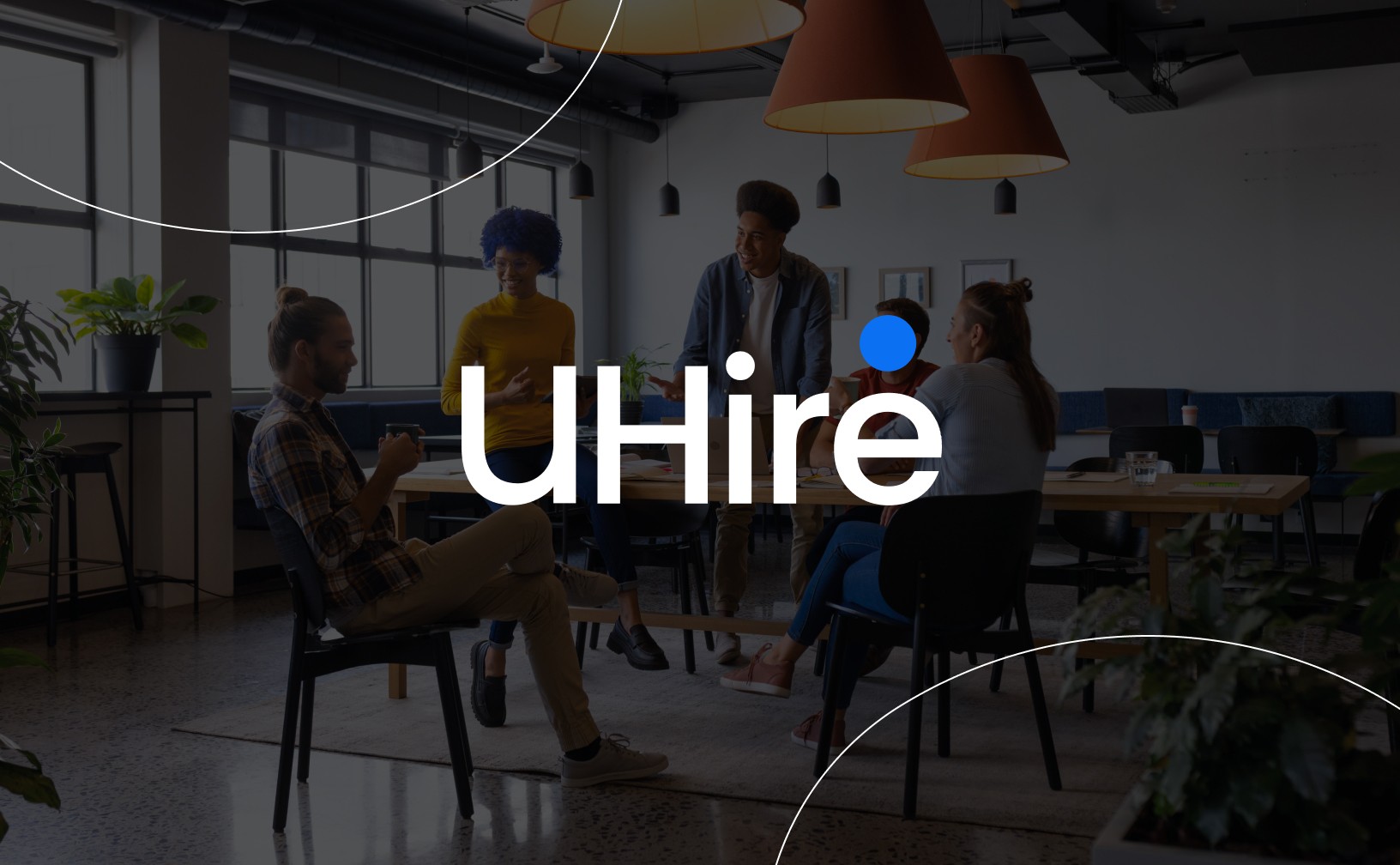 uHire logo with a background image showing an office meeting