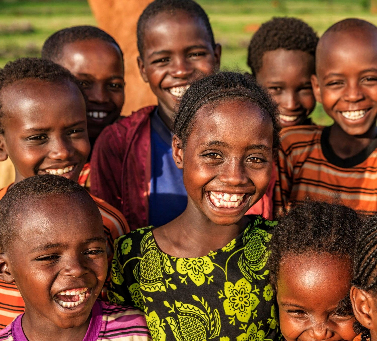 three children at the beach during golden hour