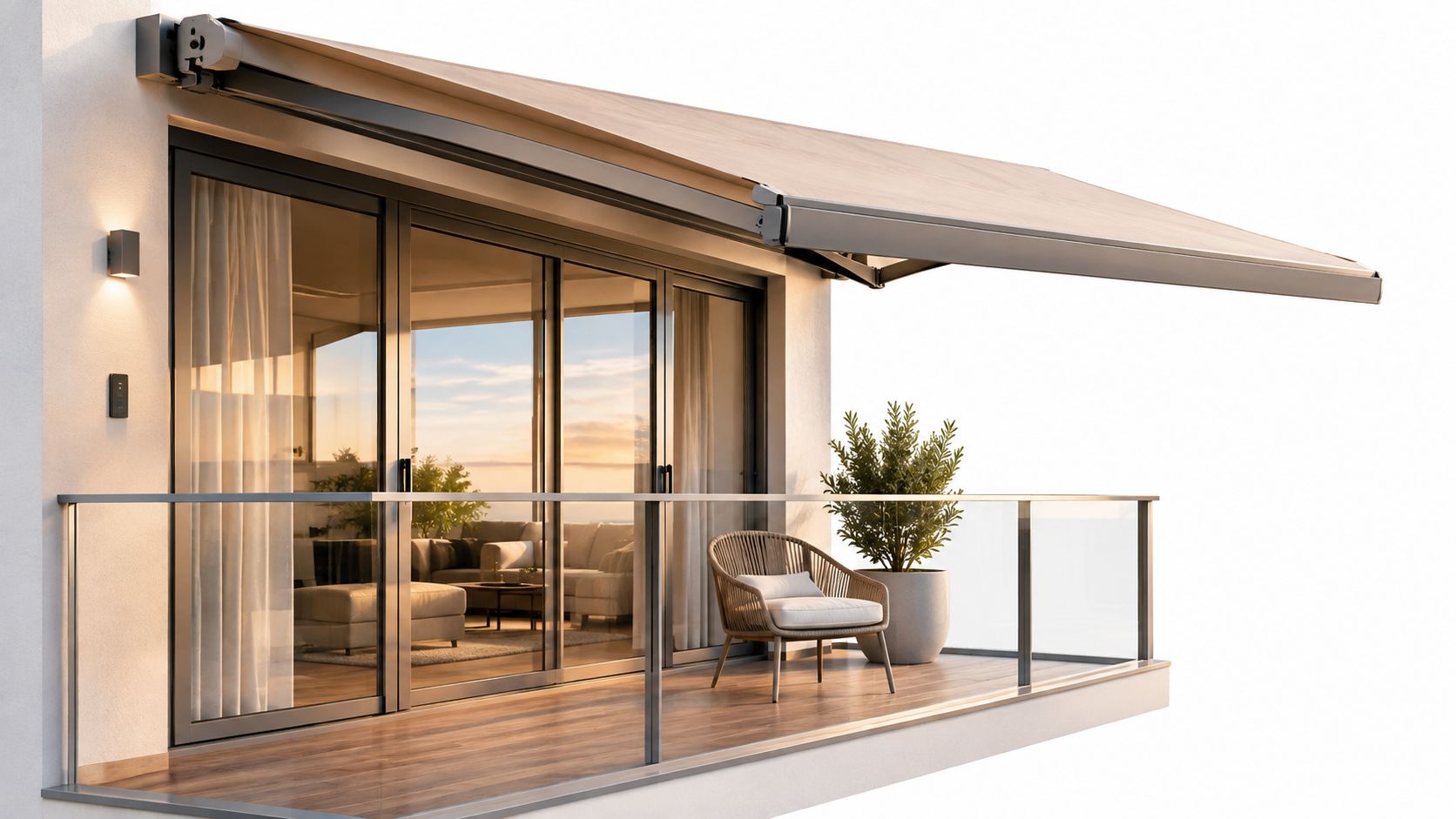 A modern balcony with a retractable awning, glass railings, cozy seating, and wooden flooring at sunset.