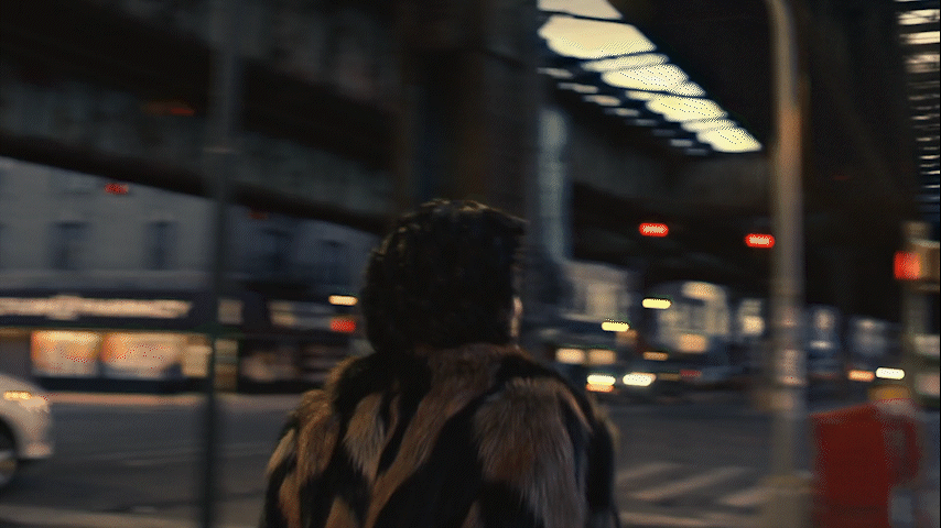 Silhouette of a person walking on a modern walkway