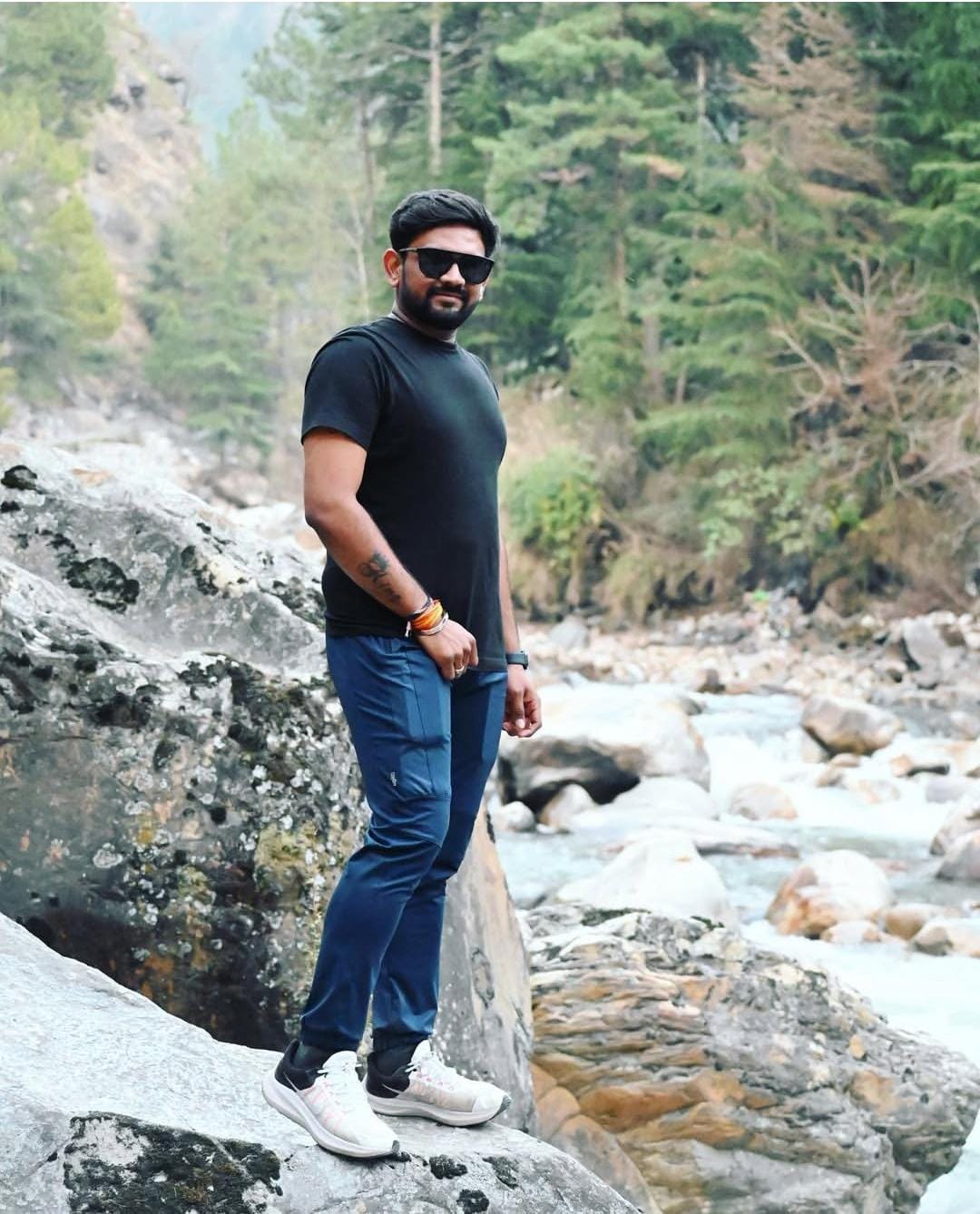 A cartoon character wearing a blue shirt and a blue hat