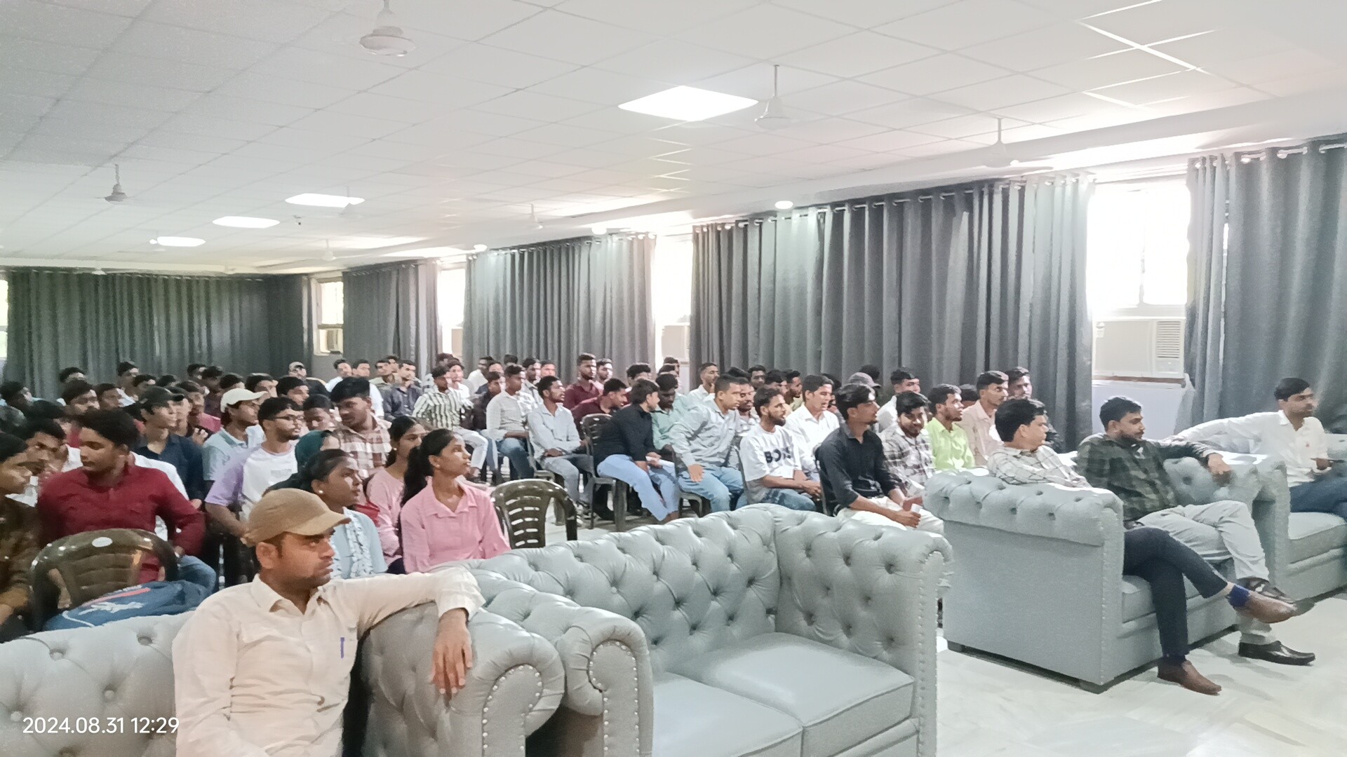 people sitting on chair in front of laptop computers