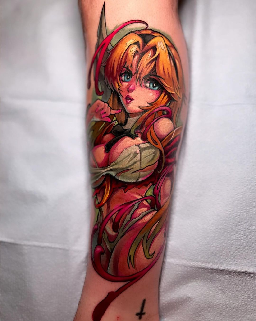 This tattoo depicts a character with blonde hair and striking blue eyes, dressed in intricate armor that emphasizes a blend of strength and beauty, capturing a heroic and vibrant essence.