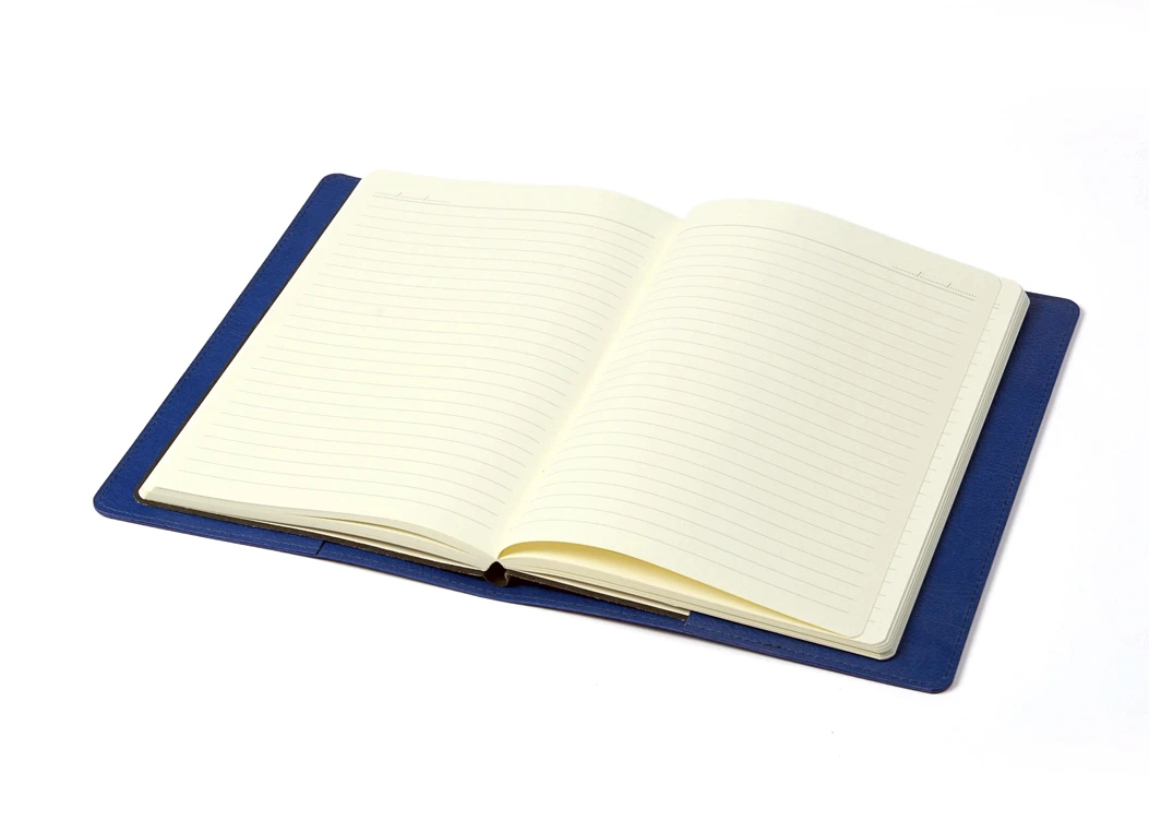Open journal with ruled ivory pages placed inside blue leather sleeve