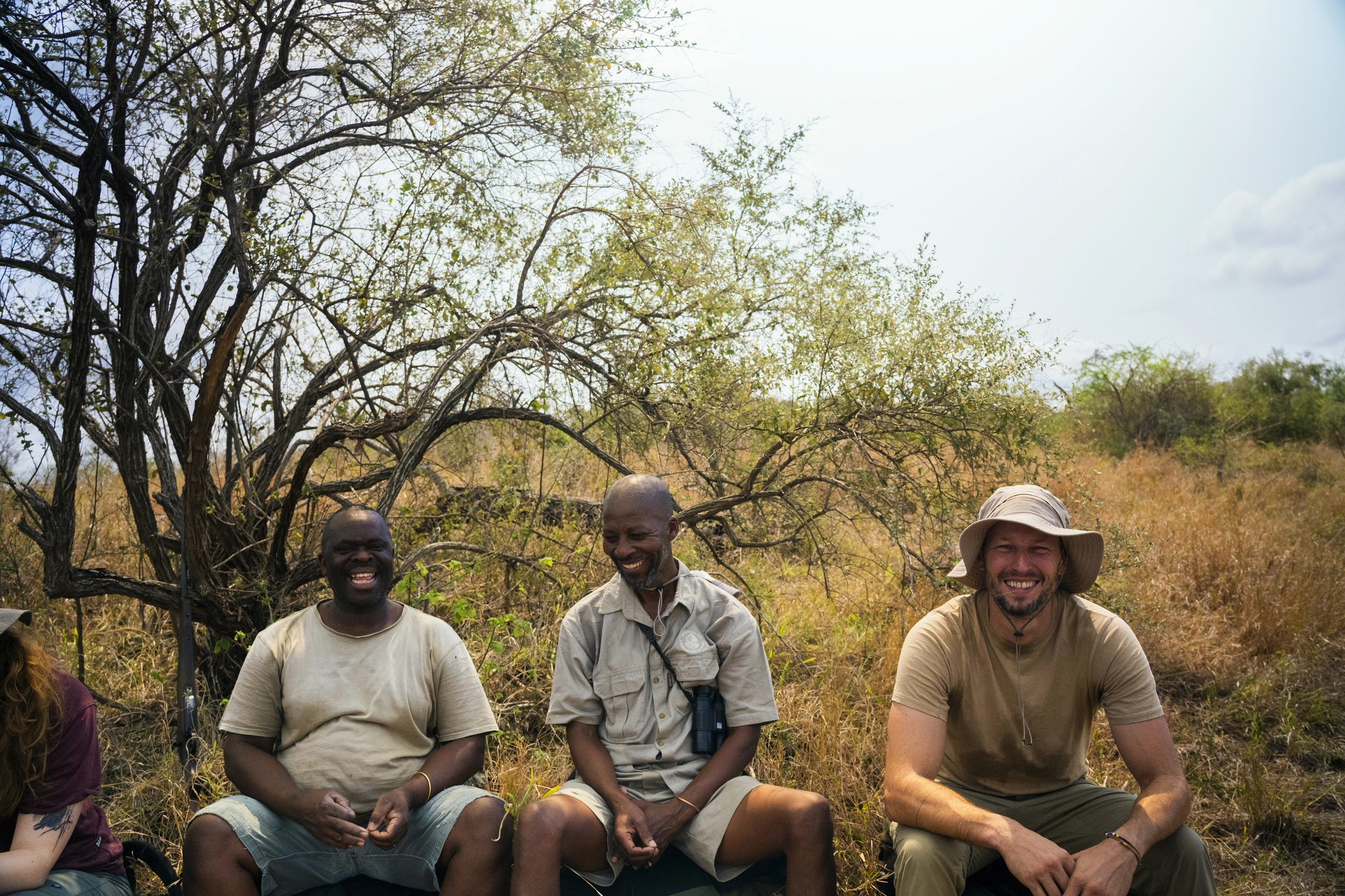 Group of hikers resting and having a laugh