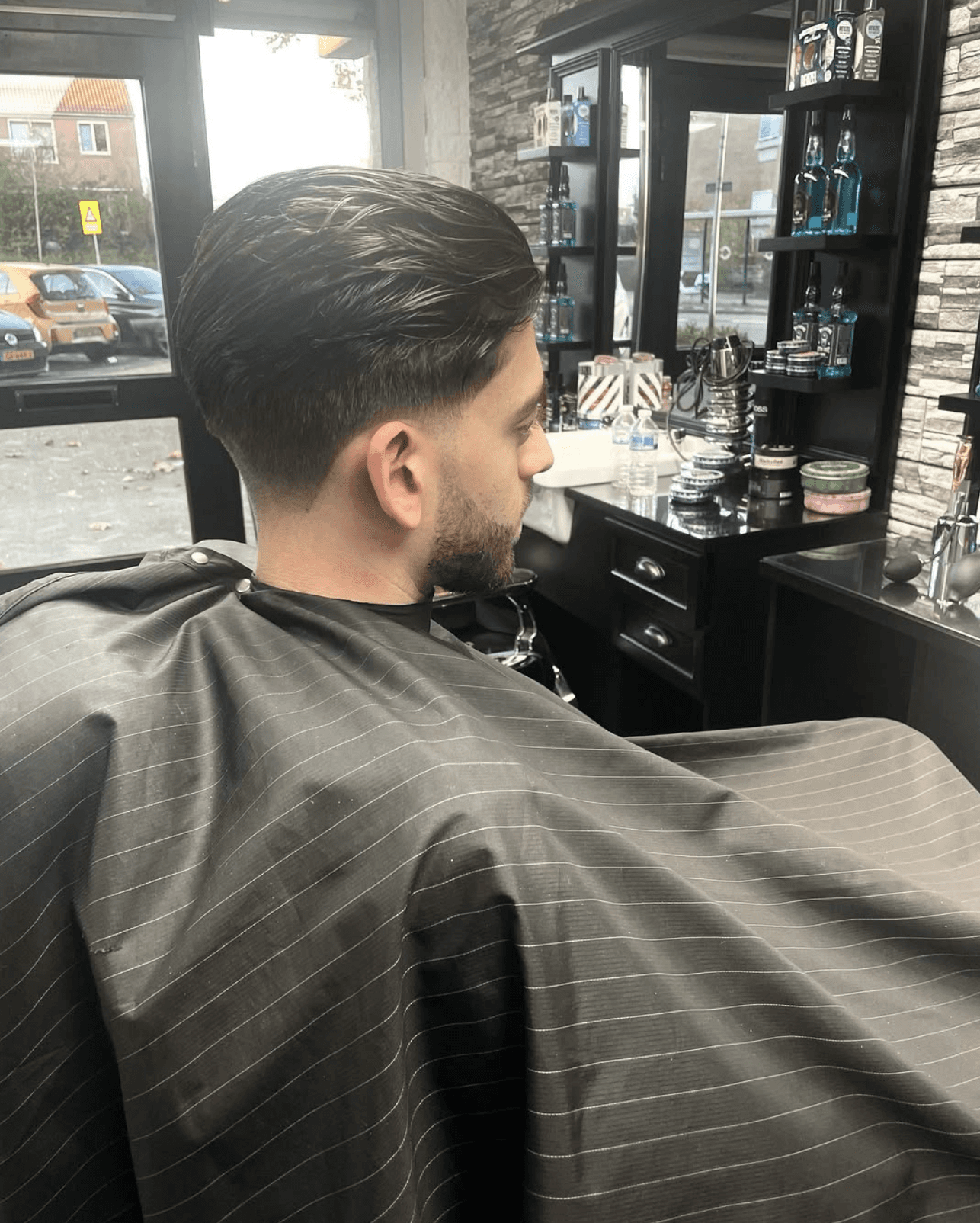 Barber attending client