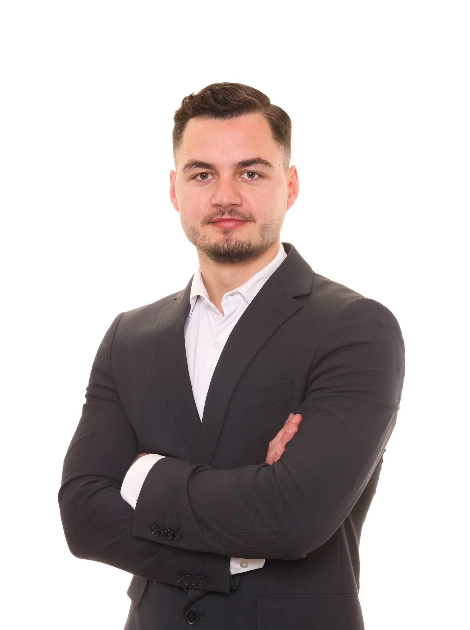 Luxury glass house next to an infinity pool at sunset.